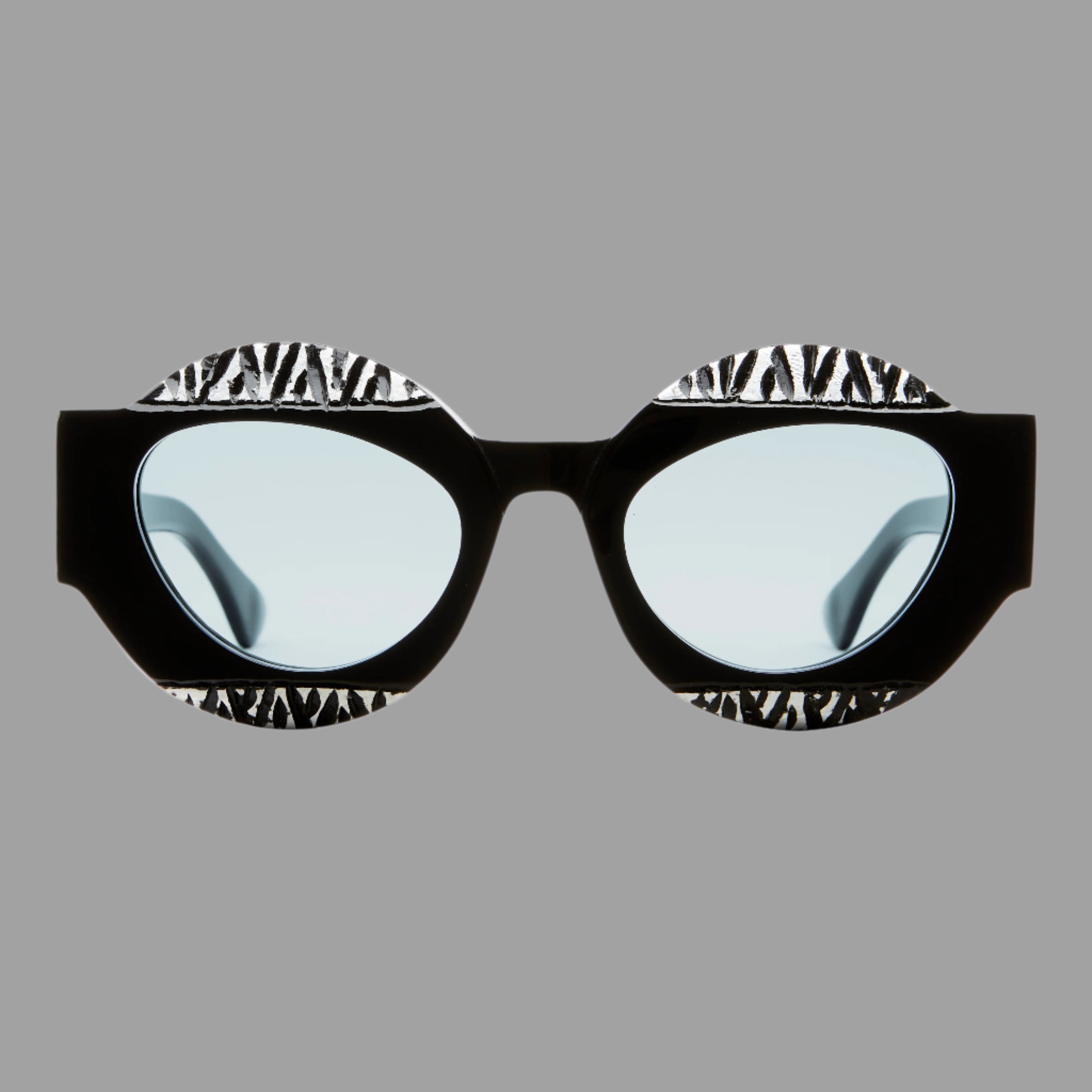 Kuboraum Berlin Mask X22 glasses, front view in black acetate with light blue lenses and silver accents.