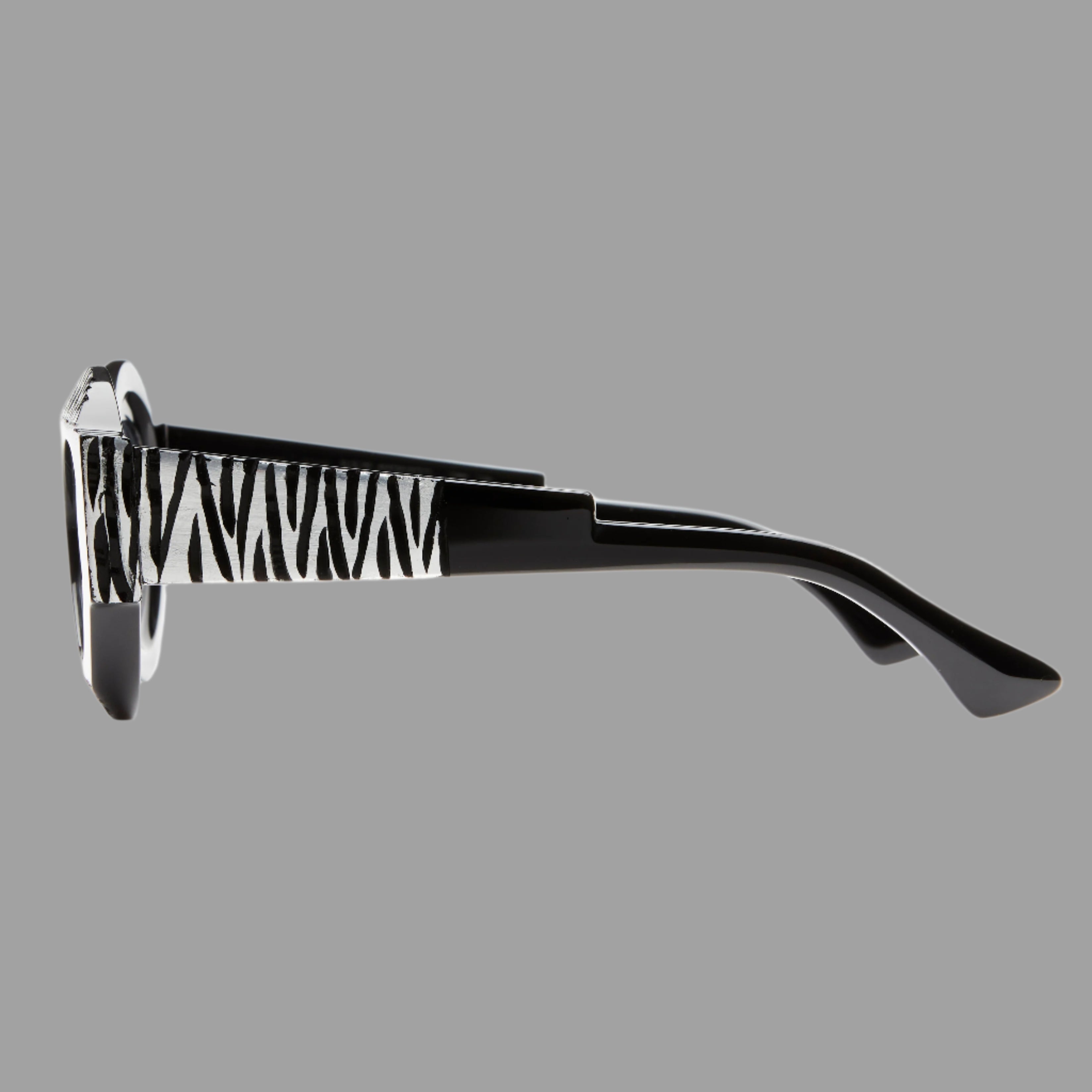 Kuboraum Berlin Mask X22 side view showcasing unique zebra-patterned temple, handcrafted black acetate design.