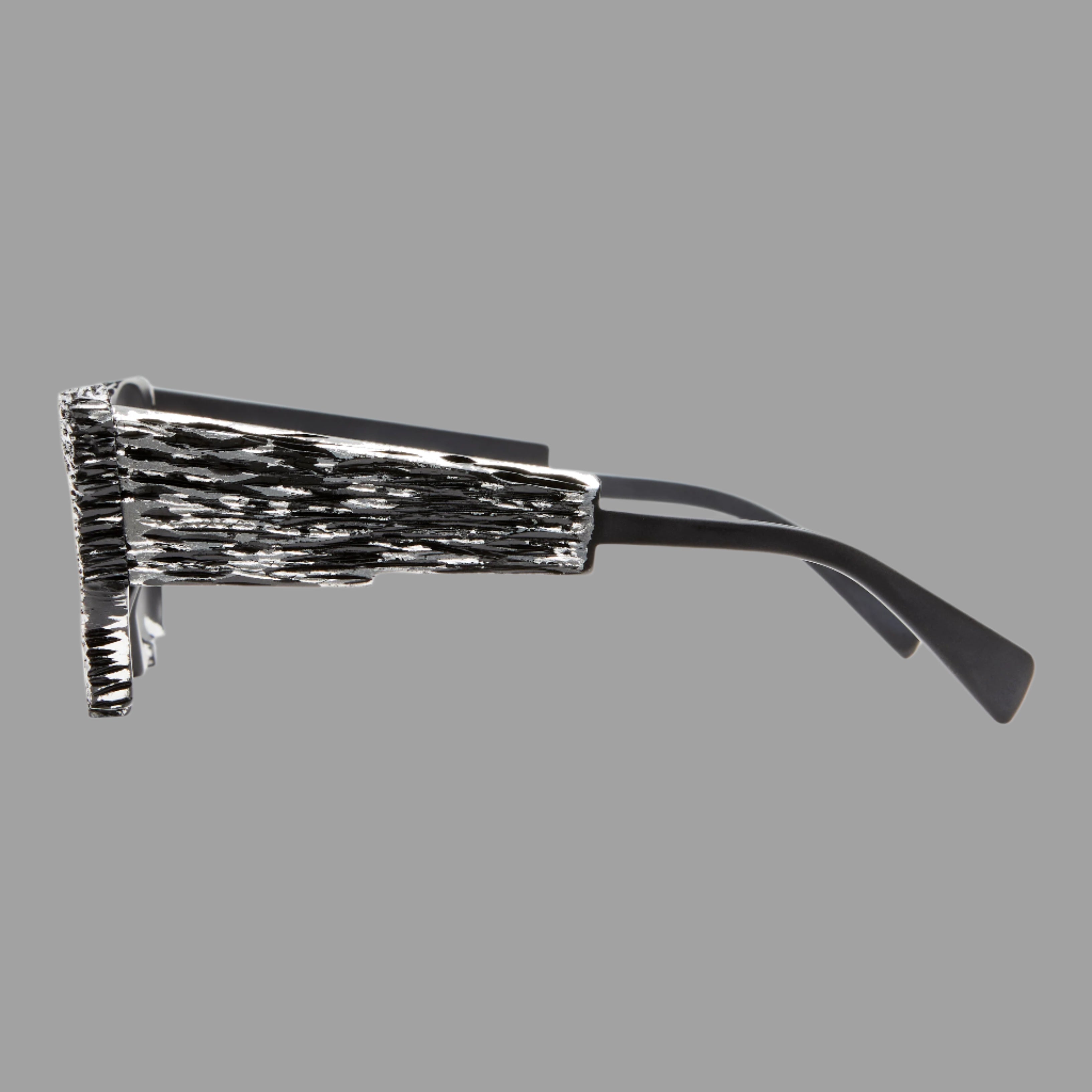 Kuboraum Berlin Mask X6 Black Matte side view showcasing textured acetate frame and sleek black arms with grey lens.