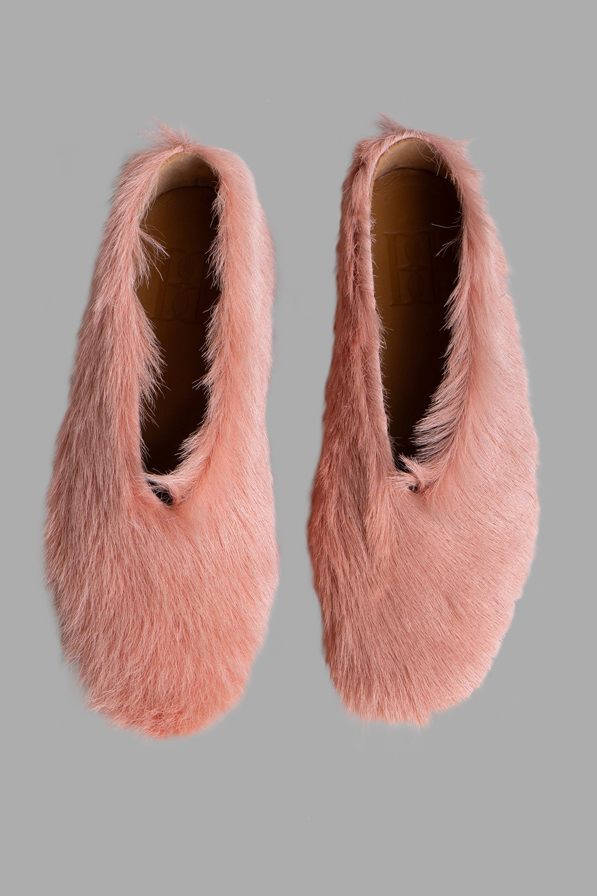 By Malene Birger Merina Leather Flats in pink, showcasing a furry texture and pointy silhouette from a top view.