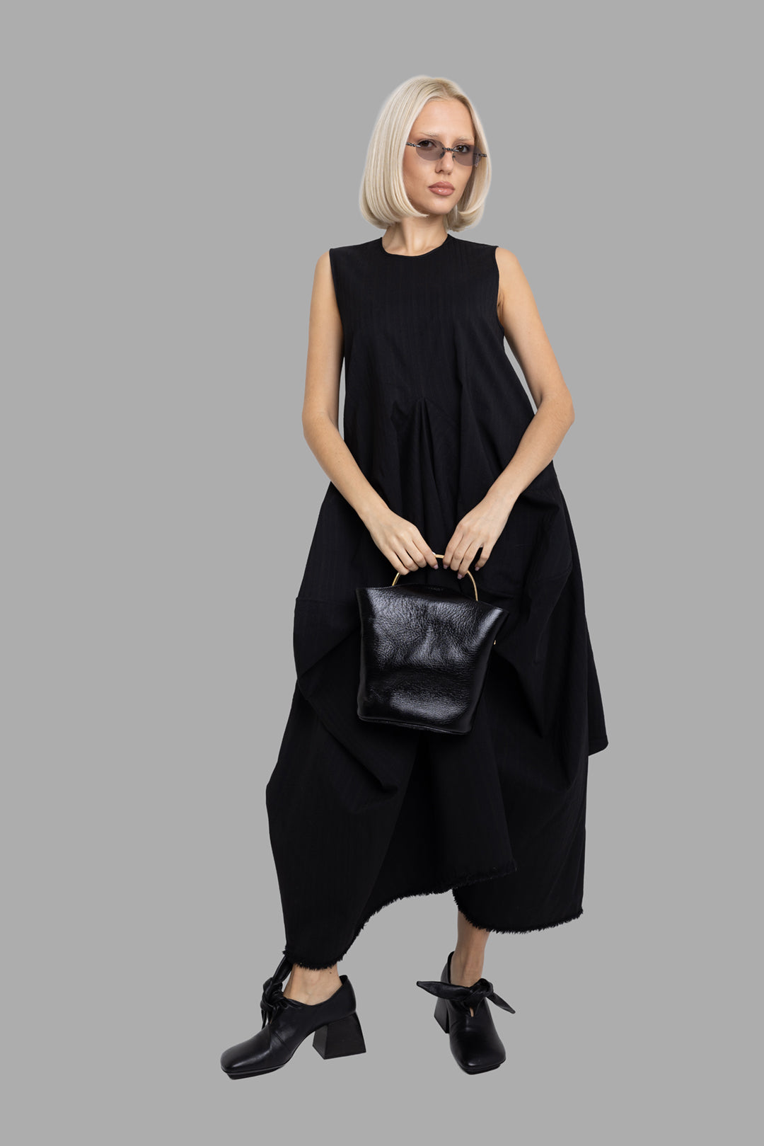 Uma Wang women's black Alani dress, on-model full-length view with sculptural draped panels and asymmetric hem