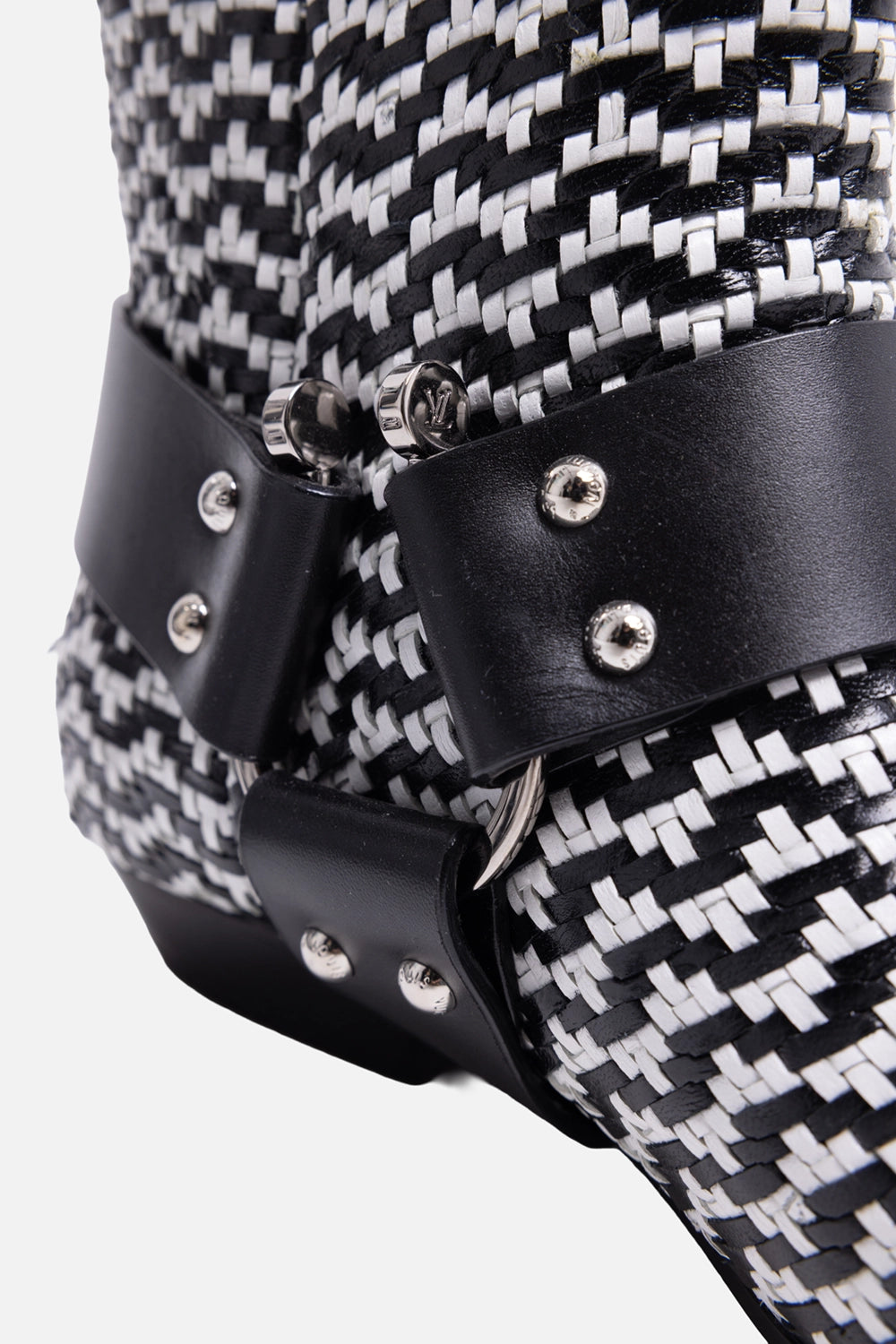 Pre-owned Louis Vuitton women’s ankle boots in black and white, hardware close-up, studded leather strap with logo snaps