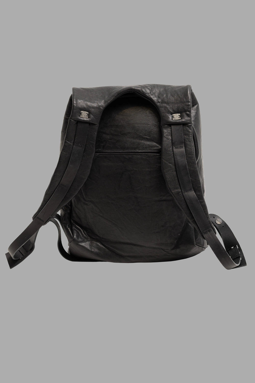 Isaac Sellam Experience unisex leather backpack in black, back view, rear zip pocket and wide straps.