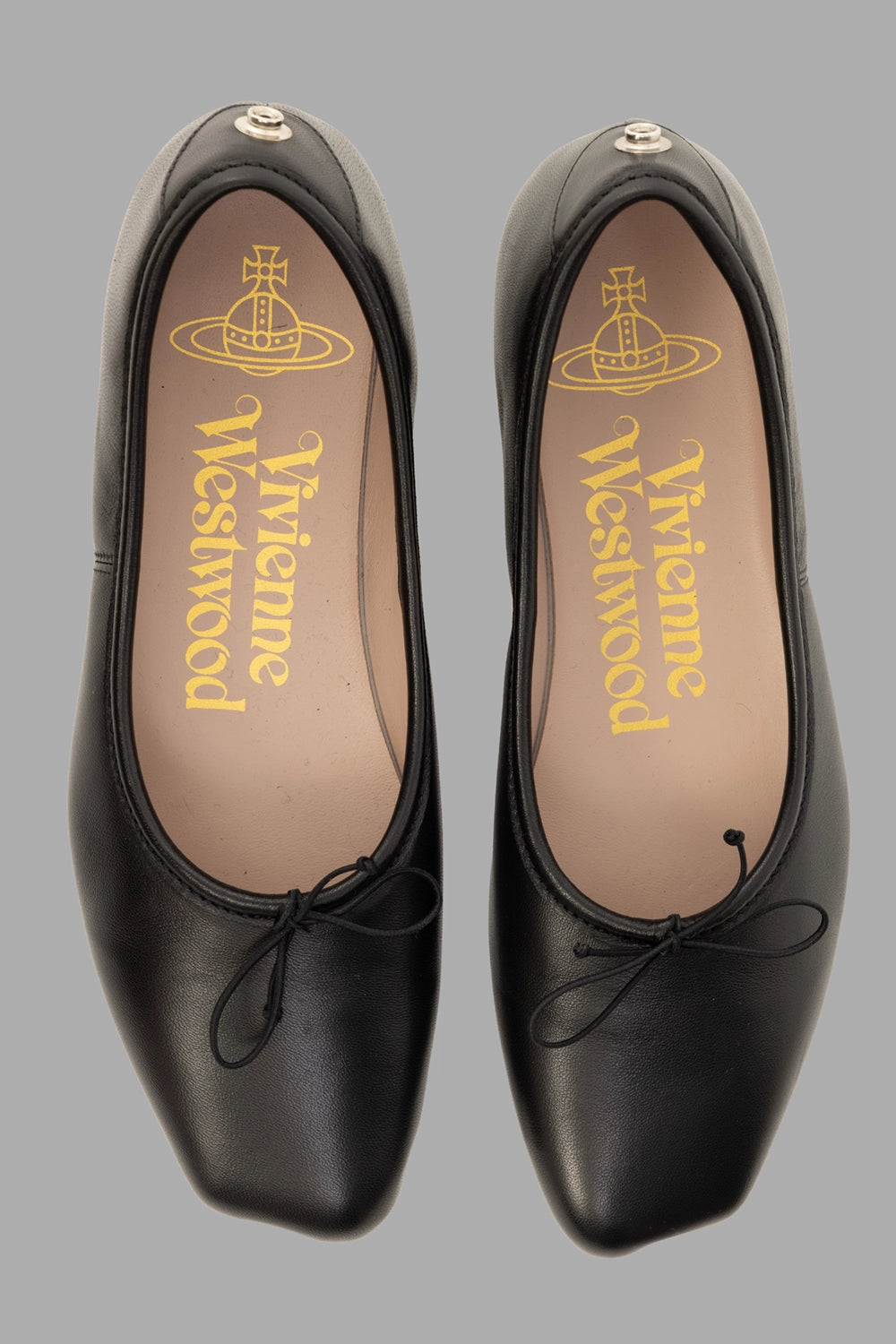 Vivienne Westwood women ballerina flats in black, pair top view, rounded-square toes and slim bow laces.