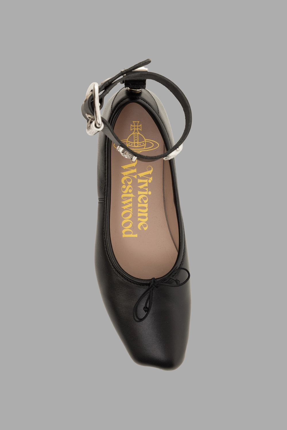 Vivienne Westwood women ballerina flats in black, top view, bow at vamp and gold logo footbed.