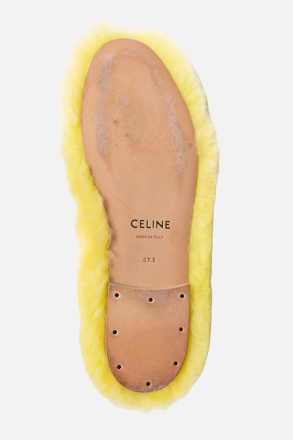 Pre-owned Celine women’s ballet flats in yellow, sole view, leather outsole with CELINE stamp and visible scuffing