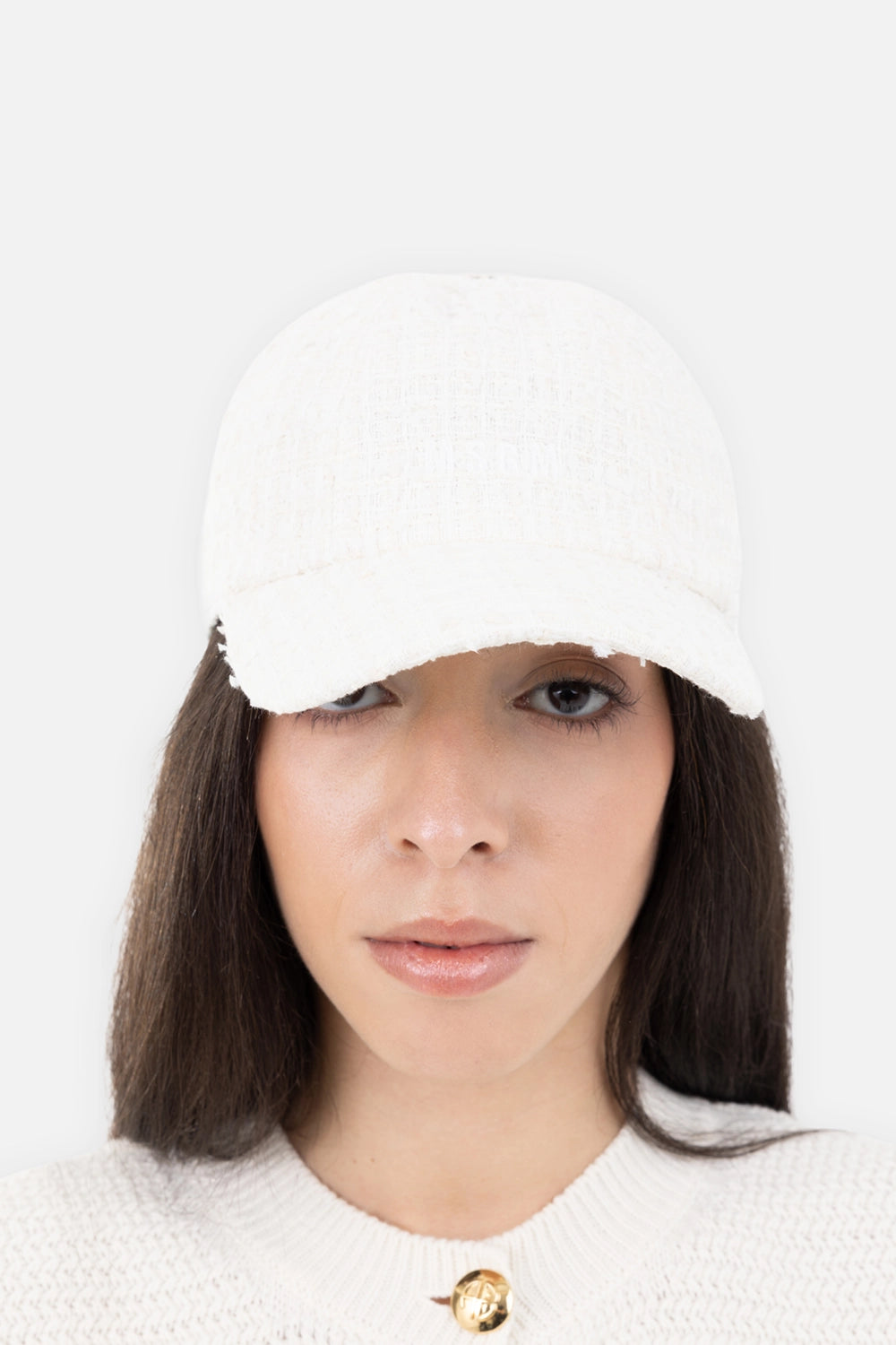 MSGM women's baseball cap in off-white, on-model front view, textured woven finish and curved brim.