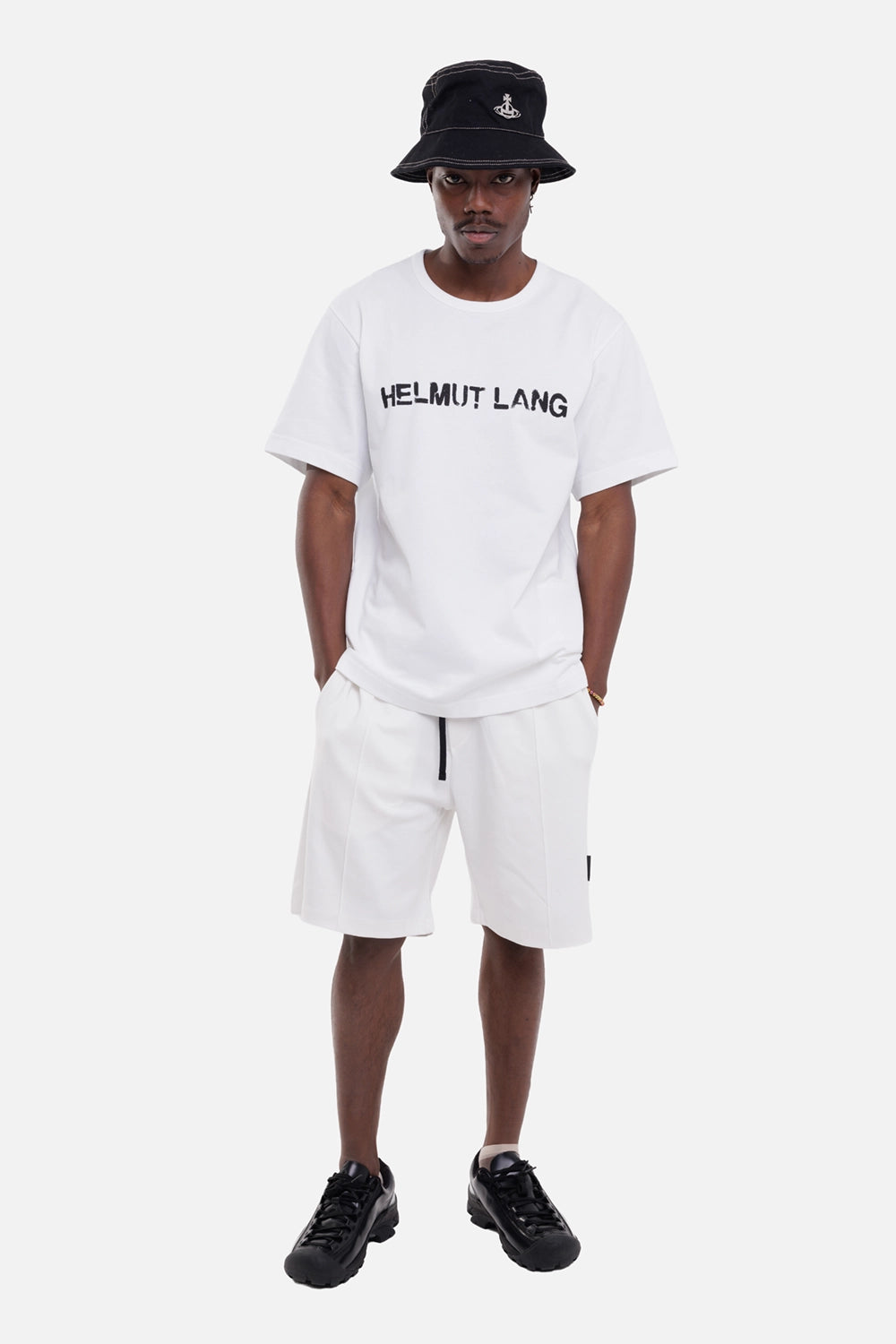 Gaëlle Paris men's Bermuda shorts in off white, on-model full-length view, elastic waist with black drawcord