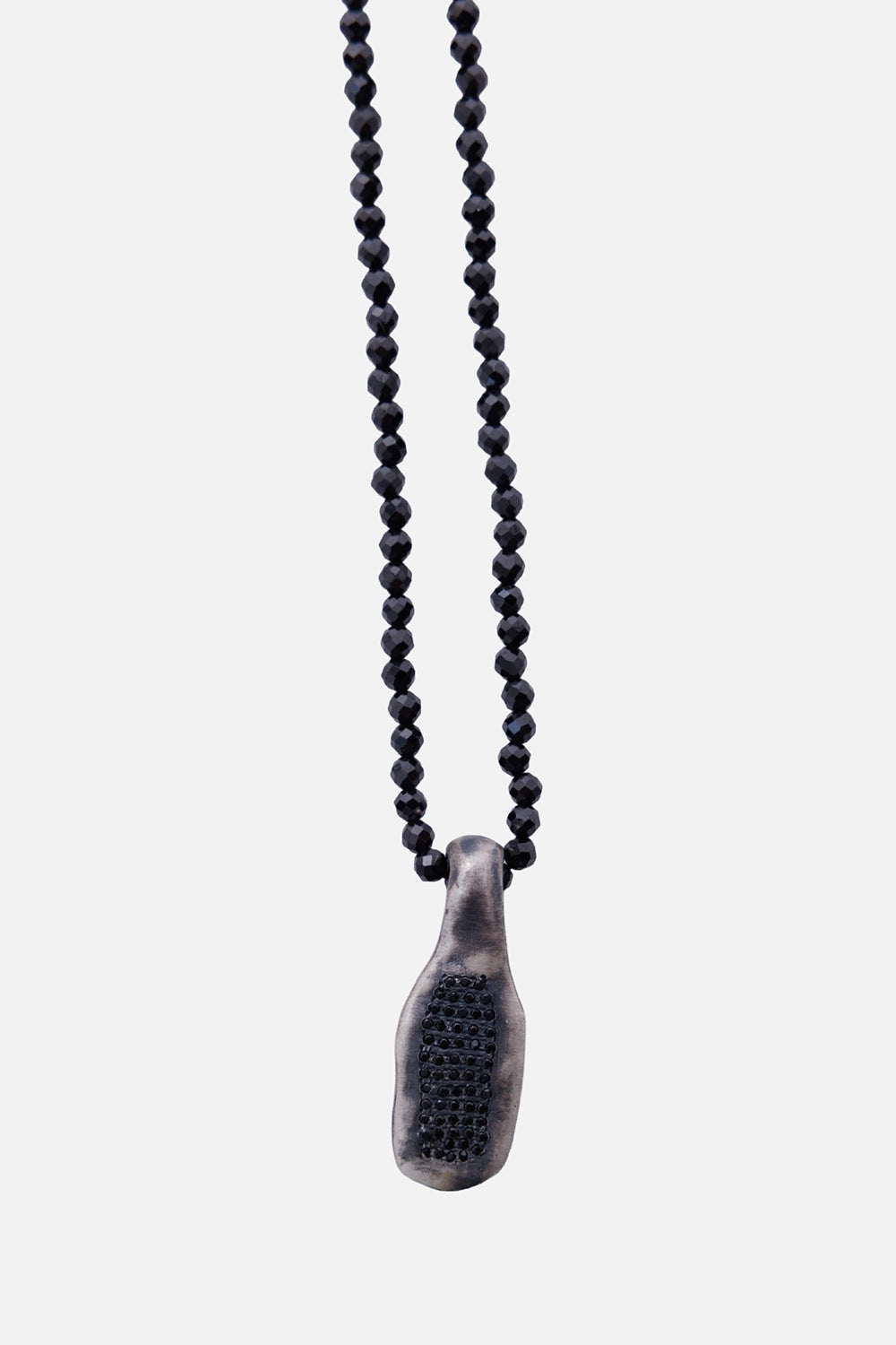 Kundo unisex beaded pendant necklace in black, pendant close-up with inset black stones and darkened metal finish
