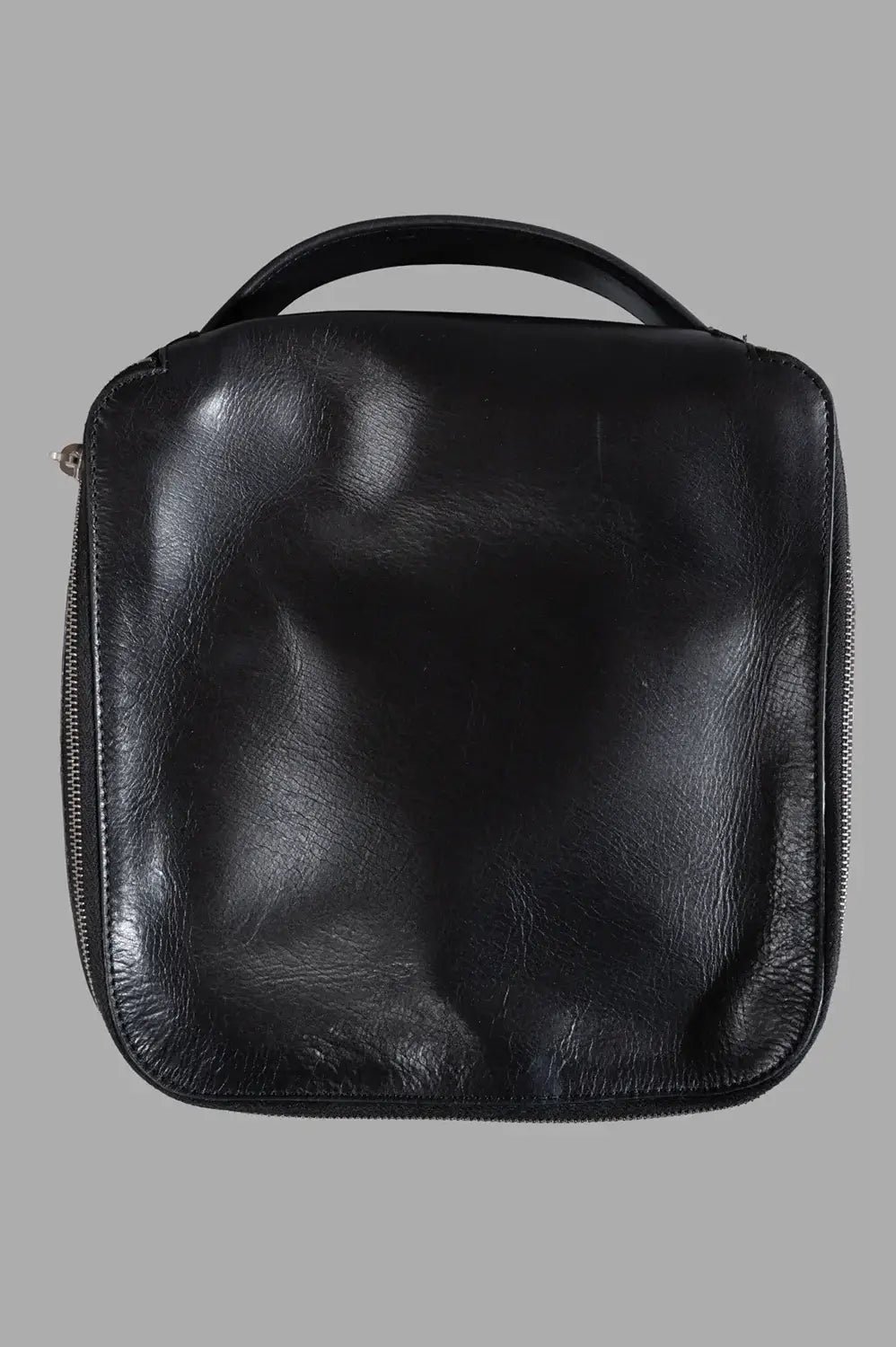 Rick Owens beauty case in black, front view, square silhouette with top handle
