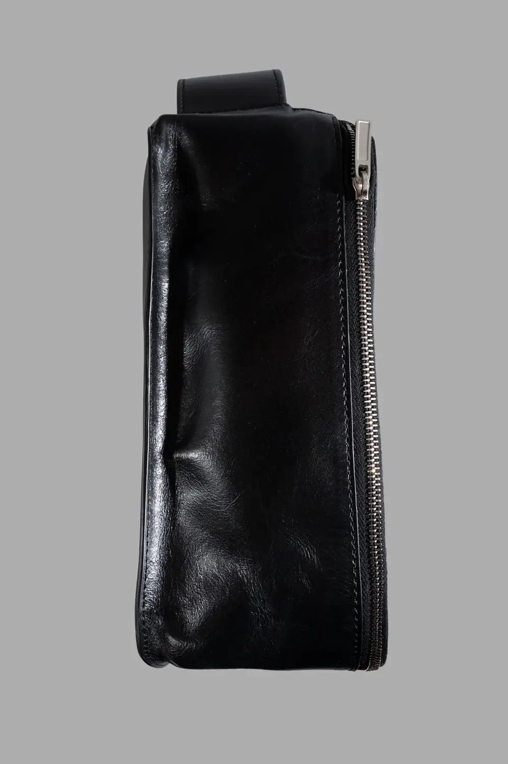 Rick Owens beauty case in black, side view, metal zip track and structured profile