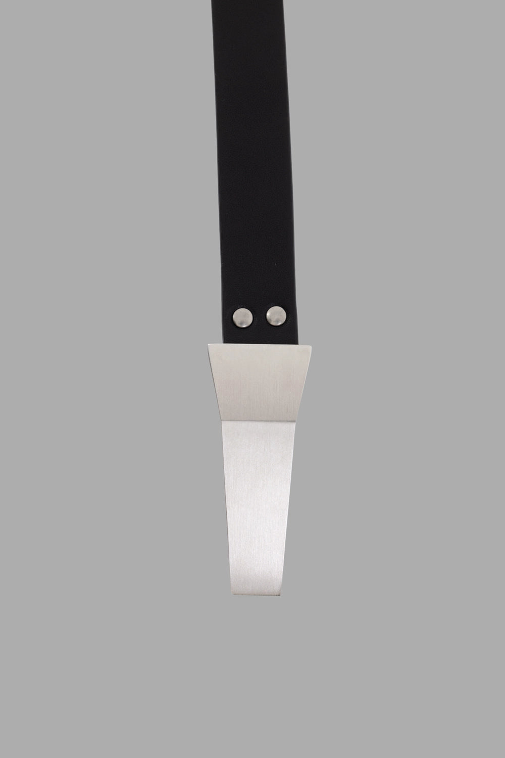 Rick Owens belt in black, hardware close-up, tapered metal Trunk buckle with two rivets
