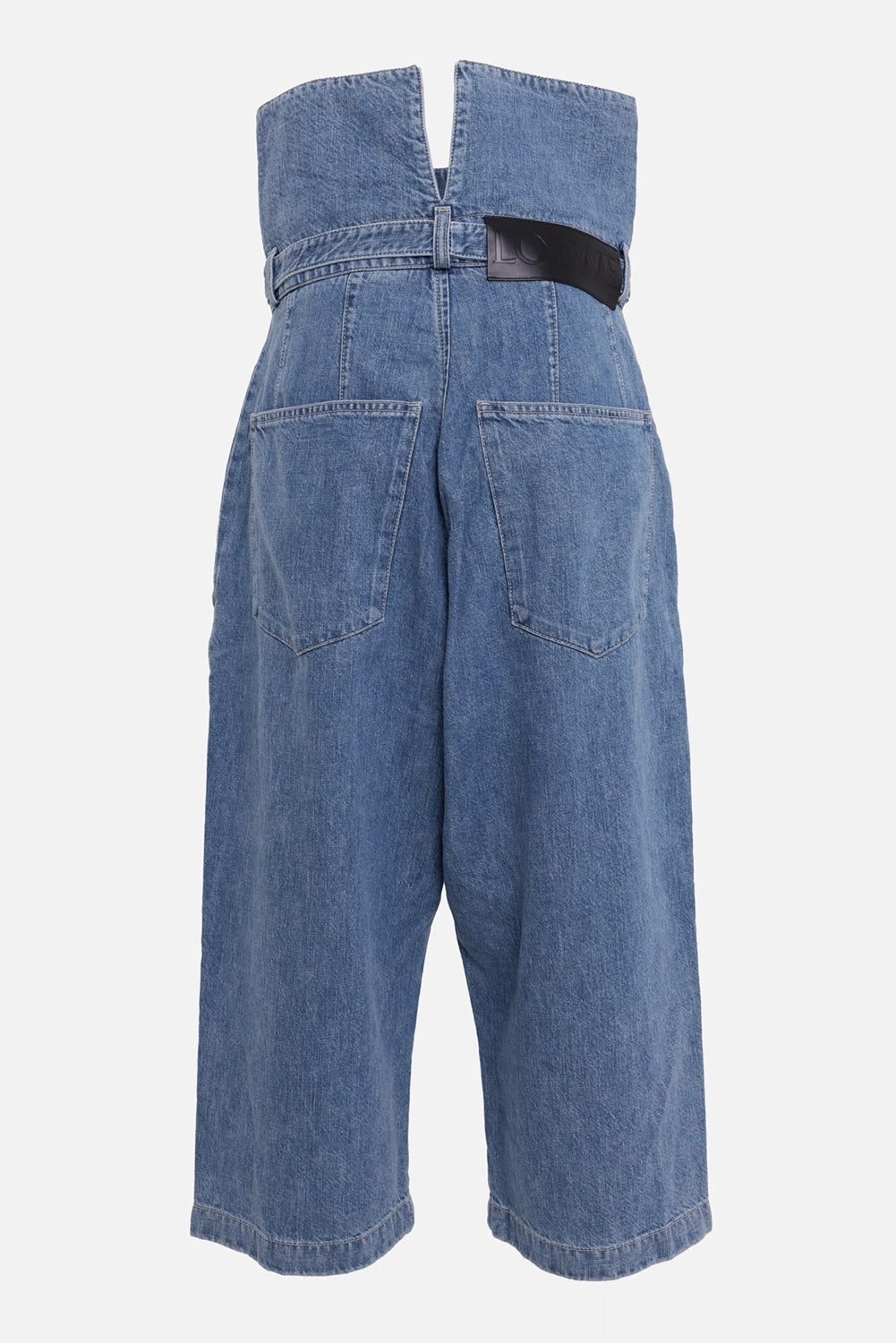 Loewe women's denim culottes in blue, back view with leather logo patch, rear pockets and split waistband