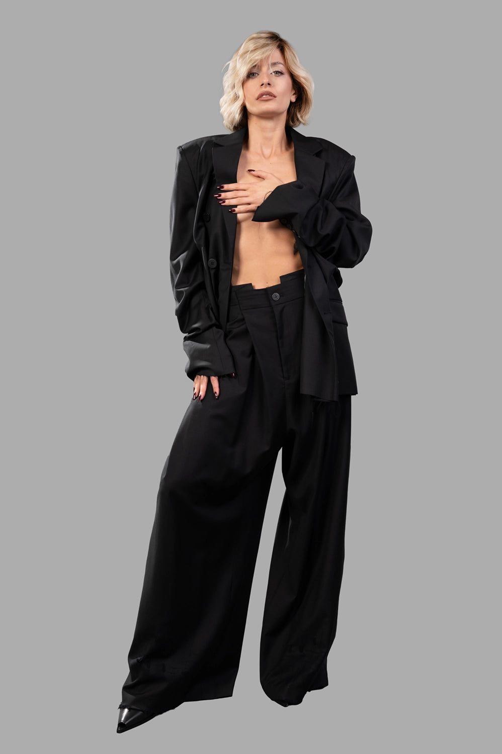 Natasha Zinko blazer in black wool‑blend, on‑model full length, structured shoulders and double‑breasted front