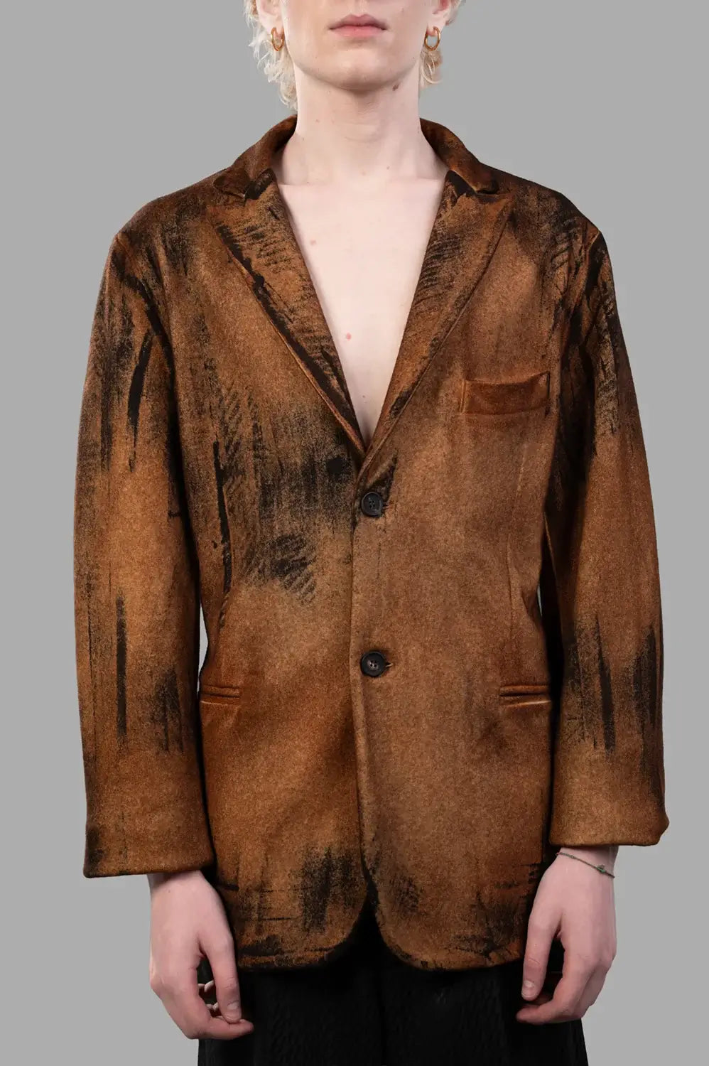Front close-up of spray-dyed wool-cashmere blazer showing lapel, pockets, and button closure