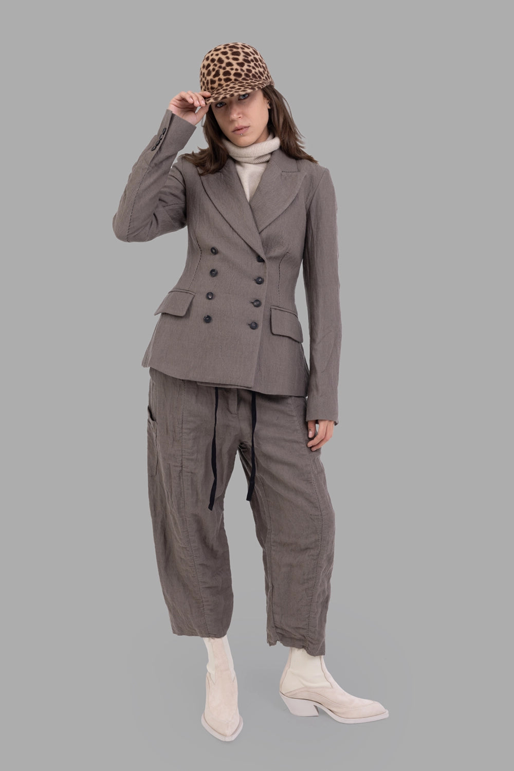 Masnada women’s blazer in dust, on-model full length, double-breasted with horn buttons and flap pockets