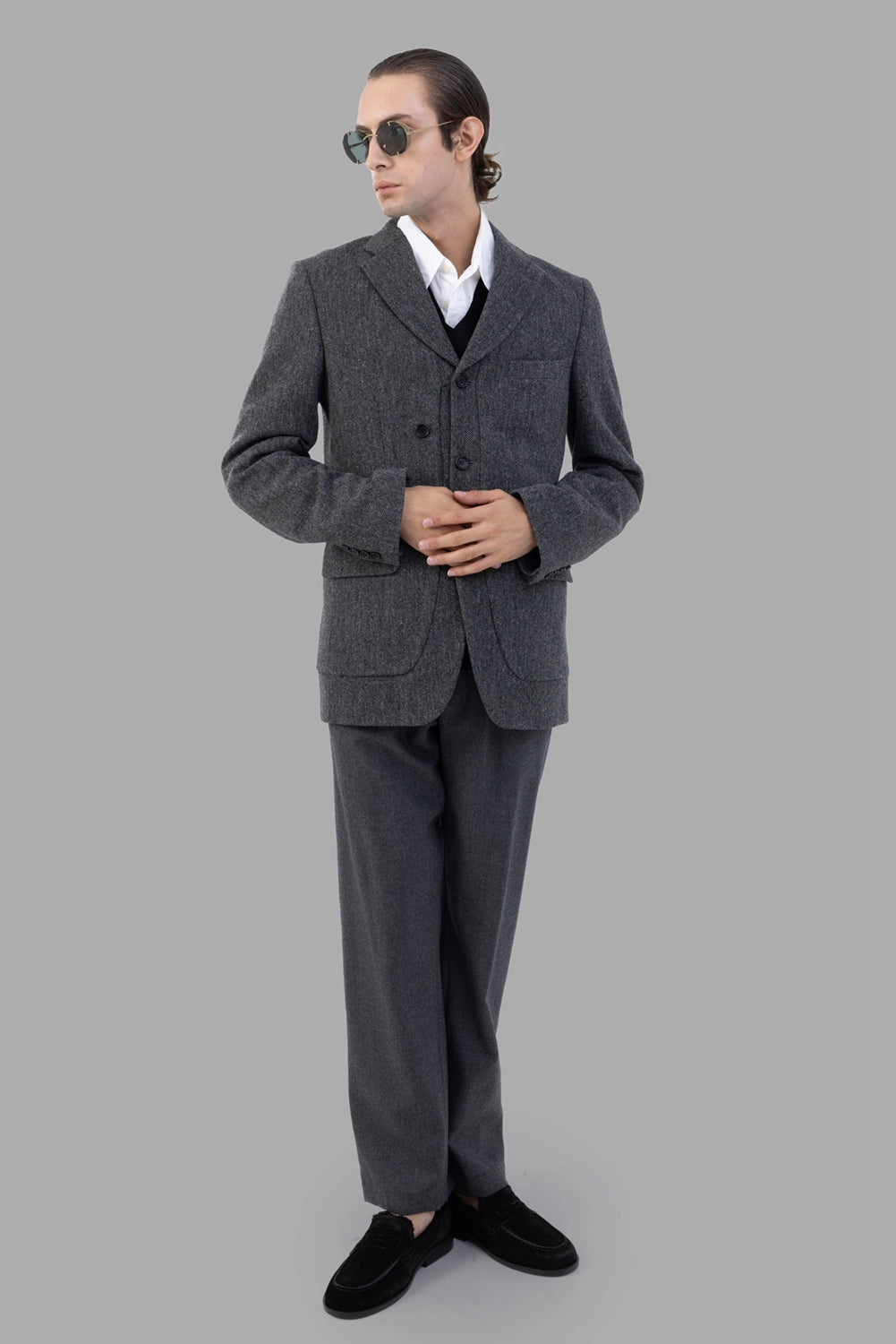 Comme des Garçons blazer in grey herringbone, on-model full length, button front and flap pockets