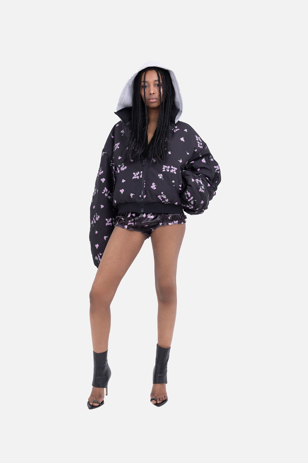Natasha Zinko women’s bloomers in black, on-model full length, glossy rose-print shorts styled with oversized jacket