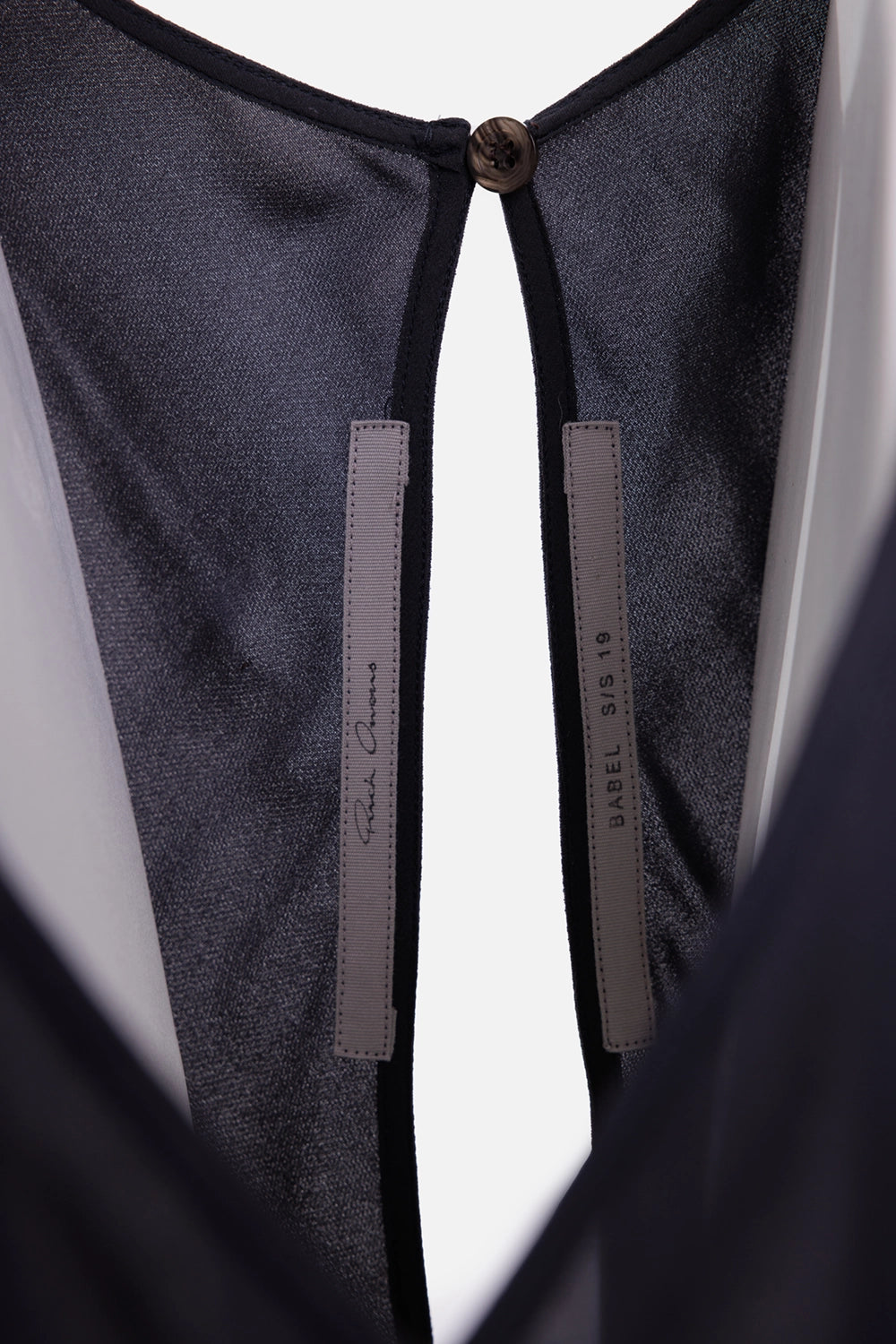 Rick Owens women's jumpsuit in black, hardware close-up, small neck button and bound back keyhole