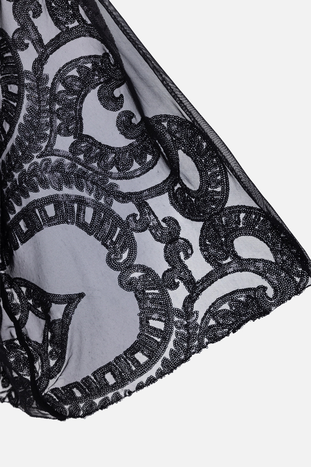 Norma Kamali women’s bodysuit in black, fabric close-up, sheer mesh with ornate sequin embroidery