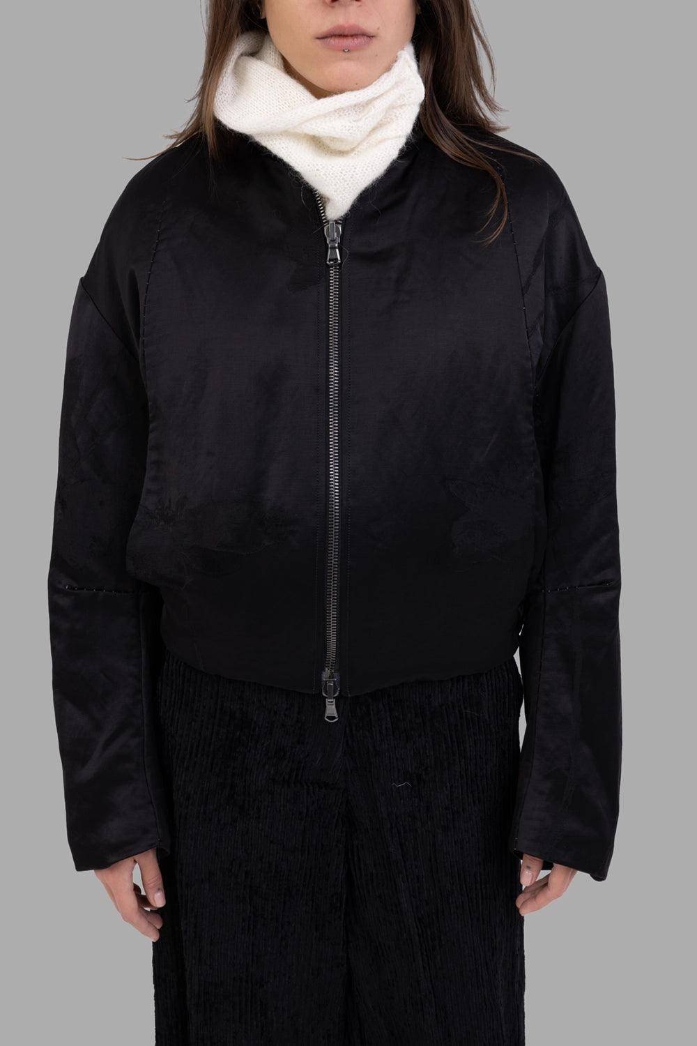 Masnada women's reversible bomber jacket in black, front view, two-way metal zip and subtle tonal motif