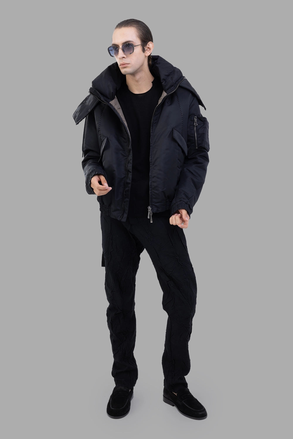 Masnada bomber jacket in black, on-model full length, relaxed fit with elastic hem