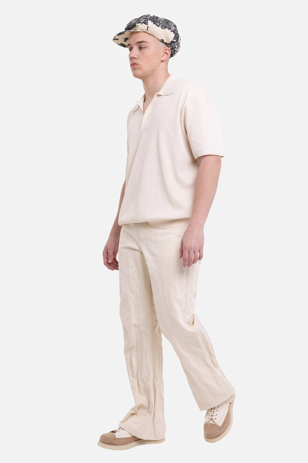 Helmut Lang men's bootcut jeans in muslin, on-model full-length view, crushed texture and slight bootcut leg