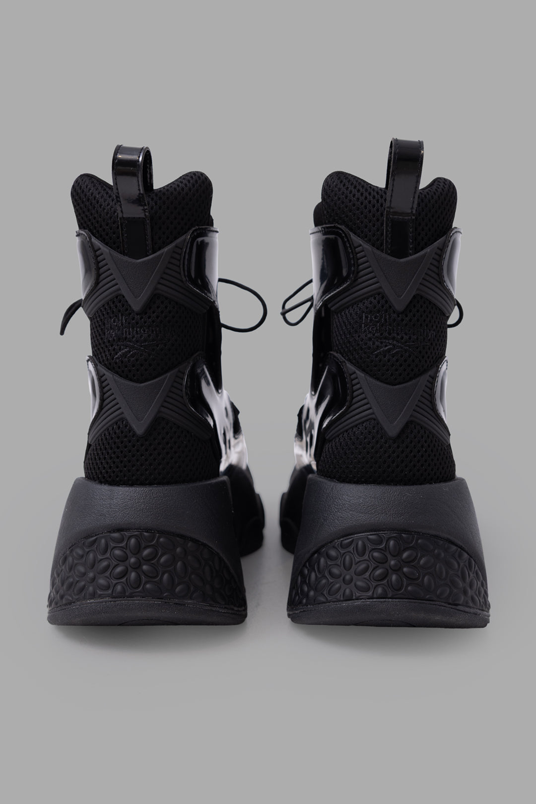 Noir Kei Ninomiya x Reebok unisex Fury Boot Hi in black, back view with pull tabs and textured heel panels