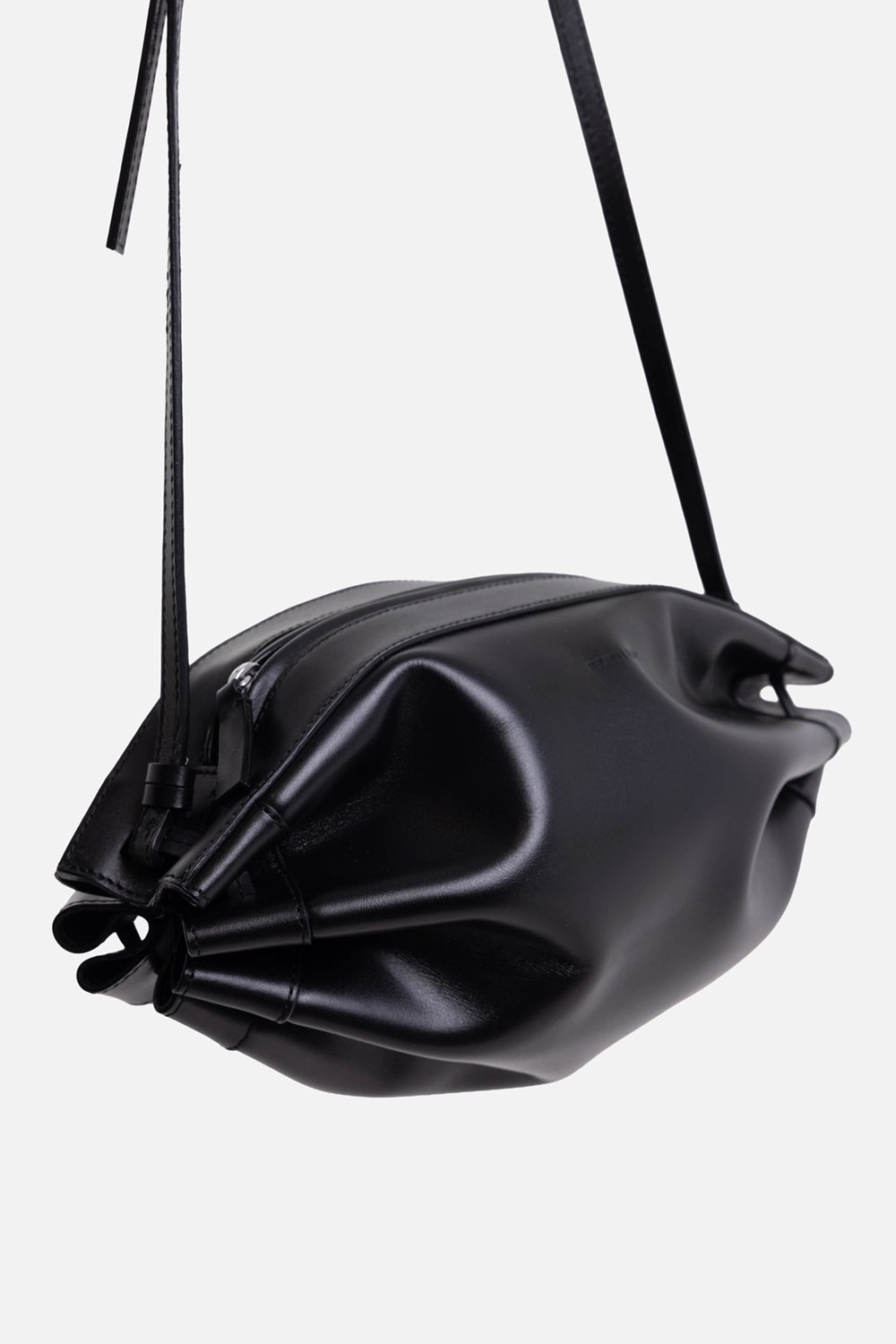 Helmut Lang women's shoulder bag in black, 3/4 view, adjustable shoulder strap and top zip closure