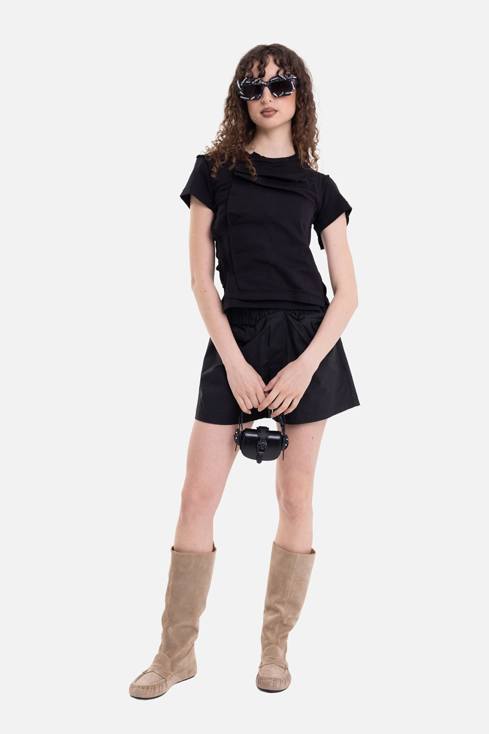 Natasha Zinko unisex boxer shorts in black, on-model full-length view, relaxed wide leg with black tee