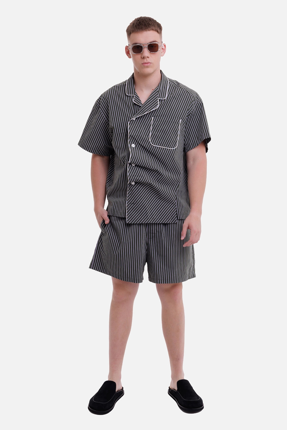 Natasha Zinko unisex green striped boxer shorts, model view with layered waistbands and matching shirt