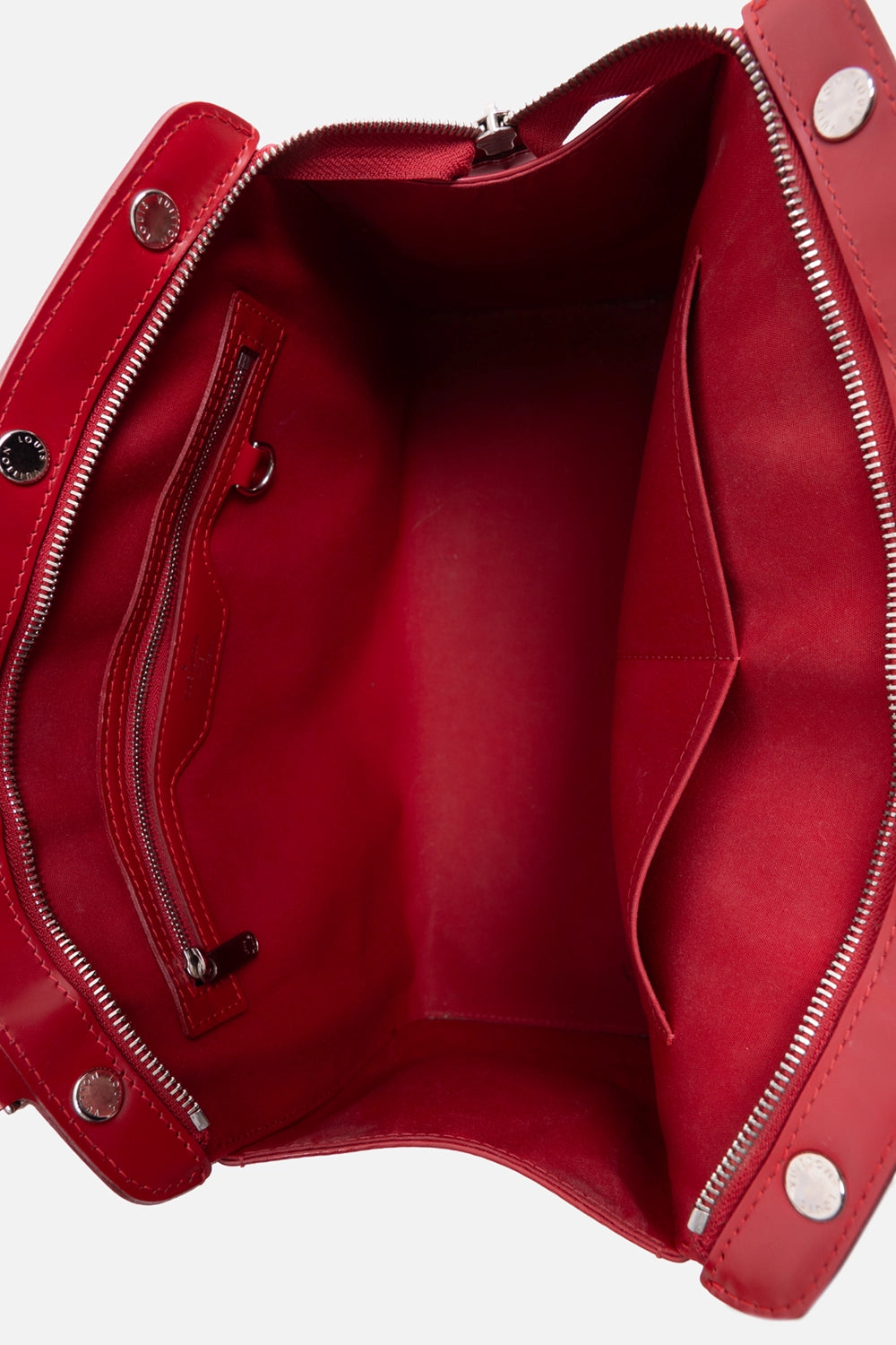 Pre-owned Louis Vuitton Brea MM satchel in red, interior view, red fabric lining with zip pocket and slip pocket.