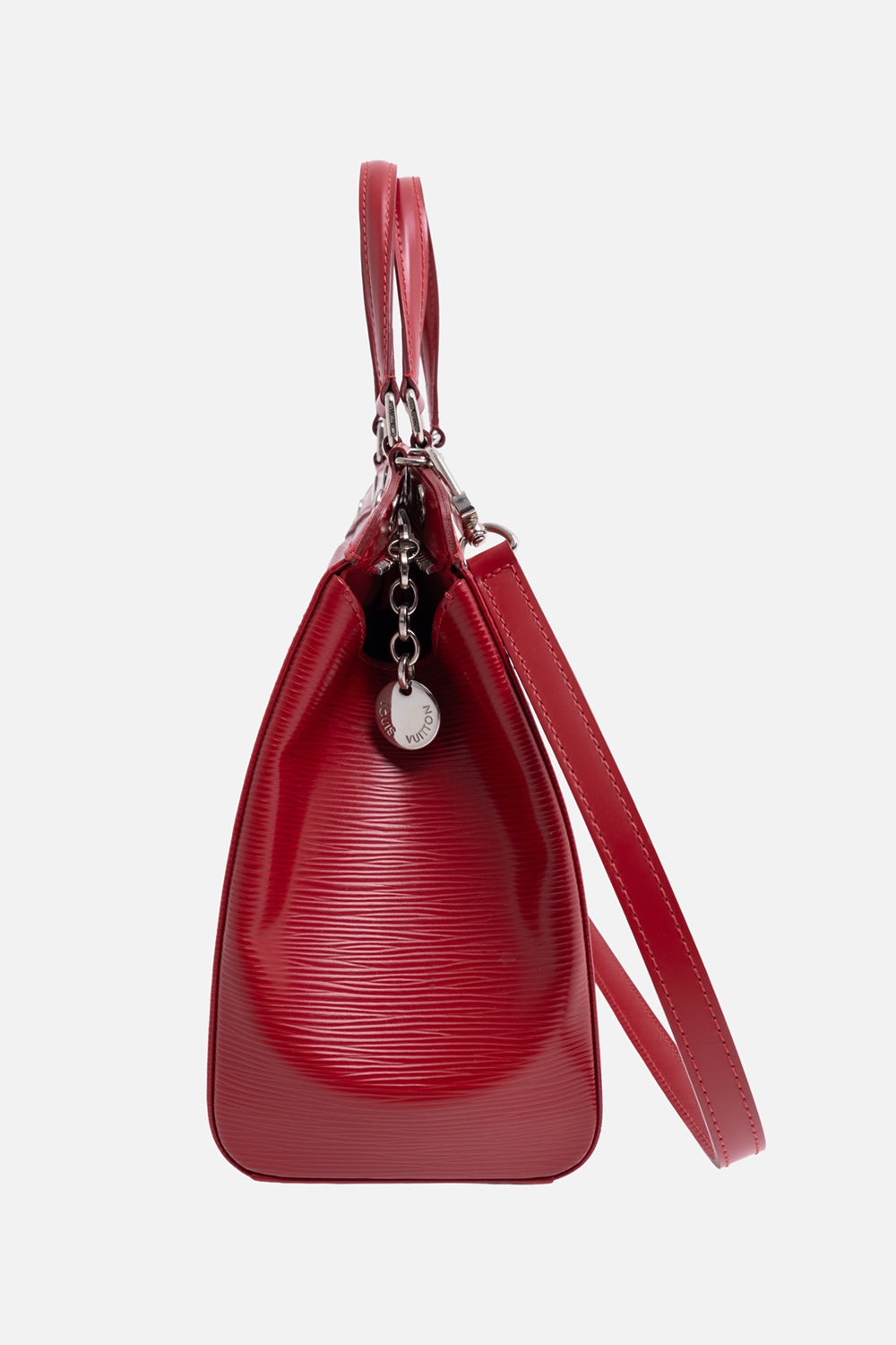 Pre-owned Louis Vuitton Brea MM satchel in red, side view, detachable shoulder strap and hanging LV charm.