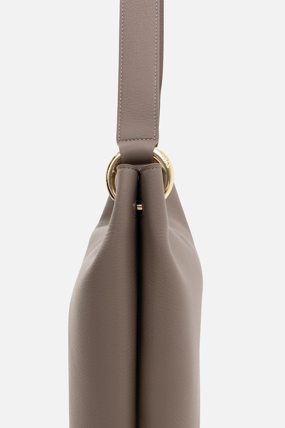 JOSEPH leather bucket bag in tartufo, hardware close-up, gold-tone ring buckle with strap attachment and edge stitching