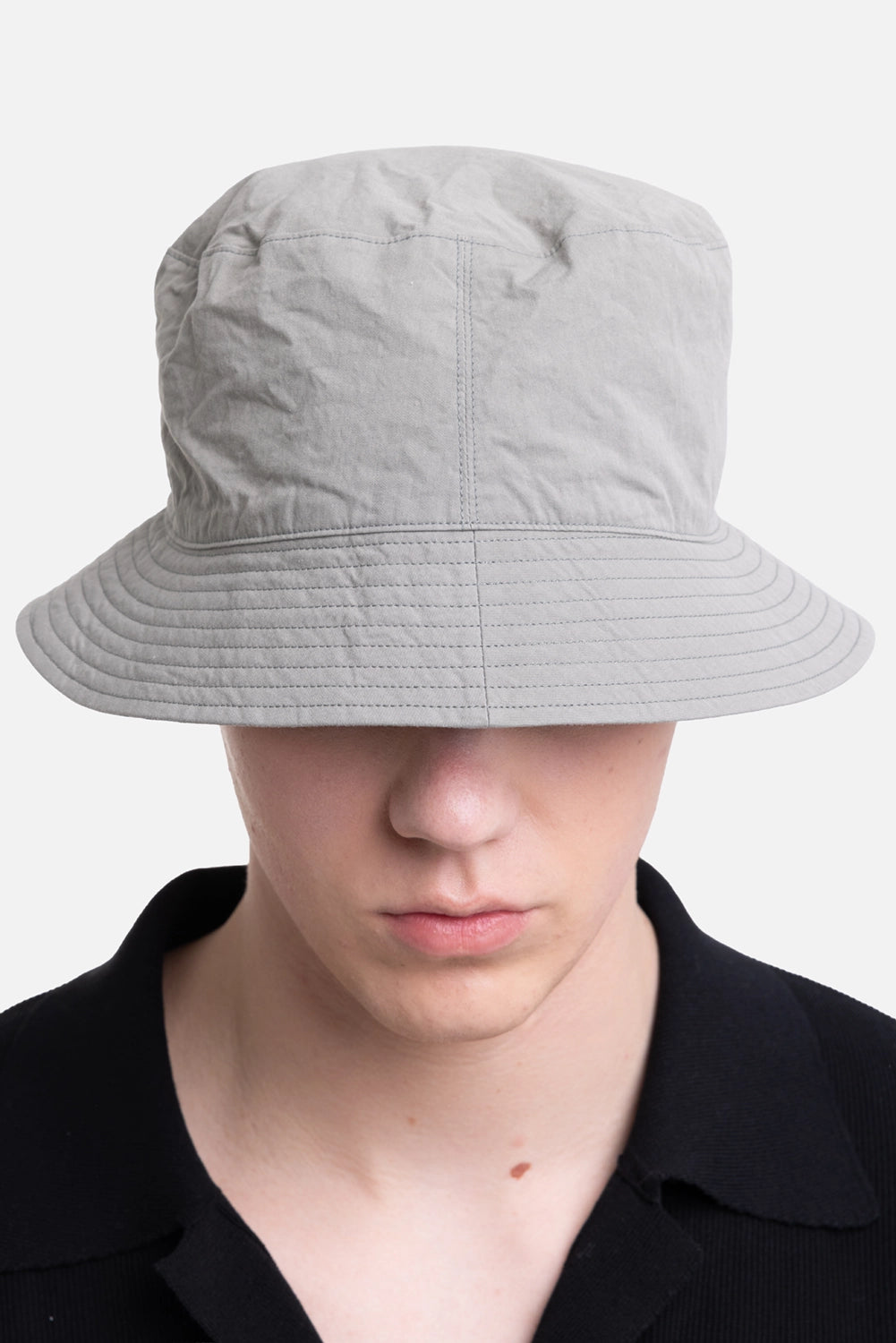 KIJIMA TAKAYUKI men's bucket hat in black/gray, front view with soft crown and wide stitched brim