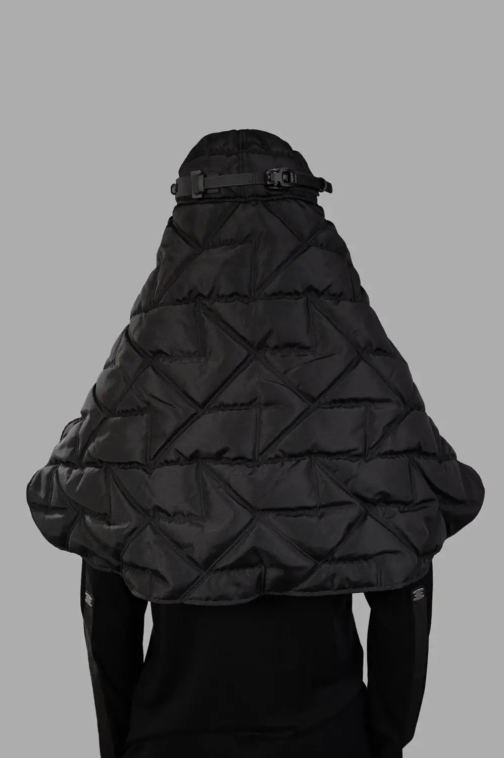 Back view of quilted veil cap with geometric stitching and adjustable buckle strap