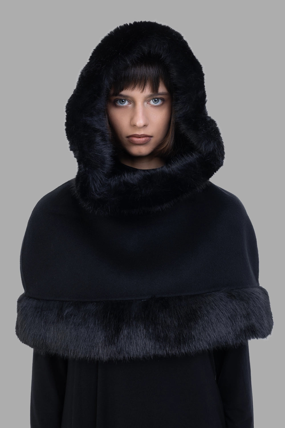 By Malene Birger women cape in black, hood detail front, plush faux-fur frame and high neck.