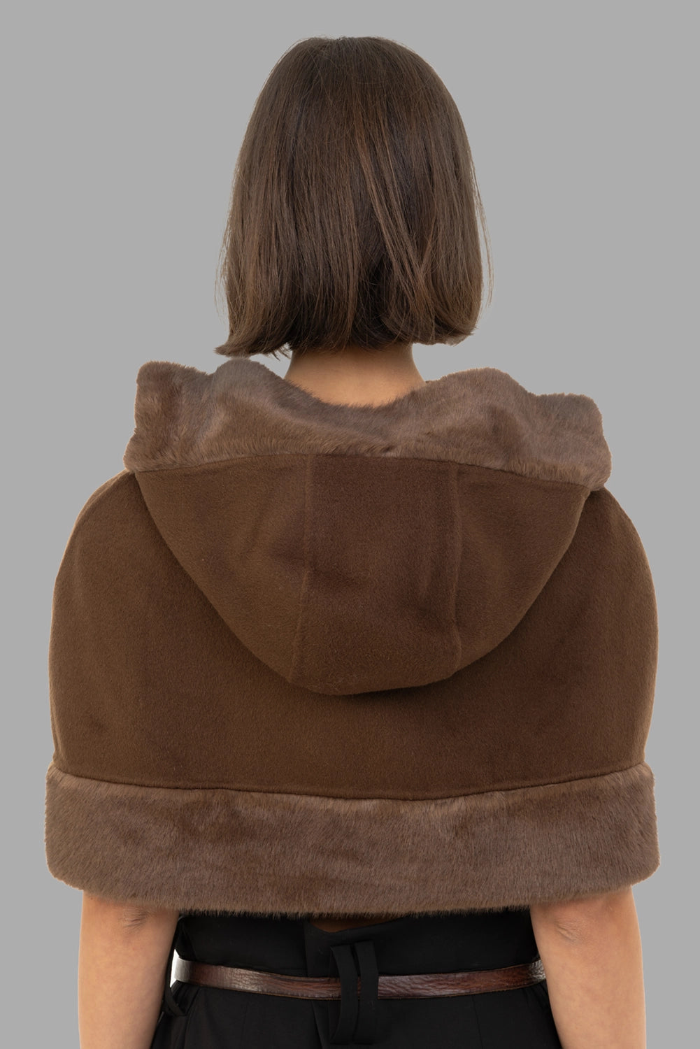 By Malene Birger women cape in Carafe, back view, hood folded down showing faux-fur edge.