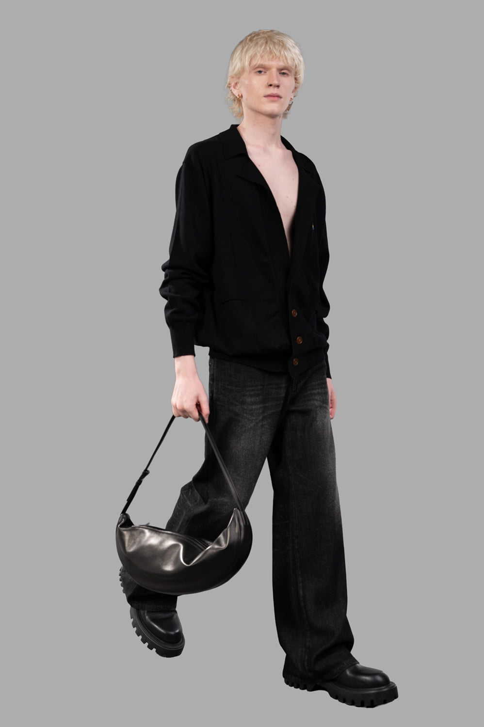 Vivienne Westwood cardigan in black, on-model full length, open collar and deep V with brown buttons
