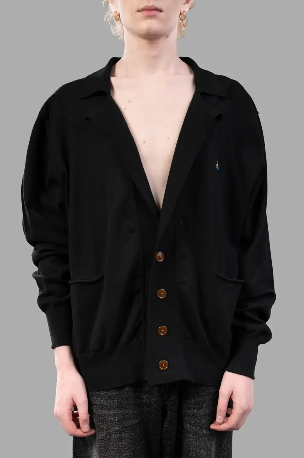 Vivienne Westwood cardigan in black, on-model half length, notched collar, patch pockets and amber buttons