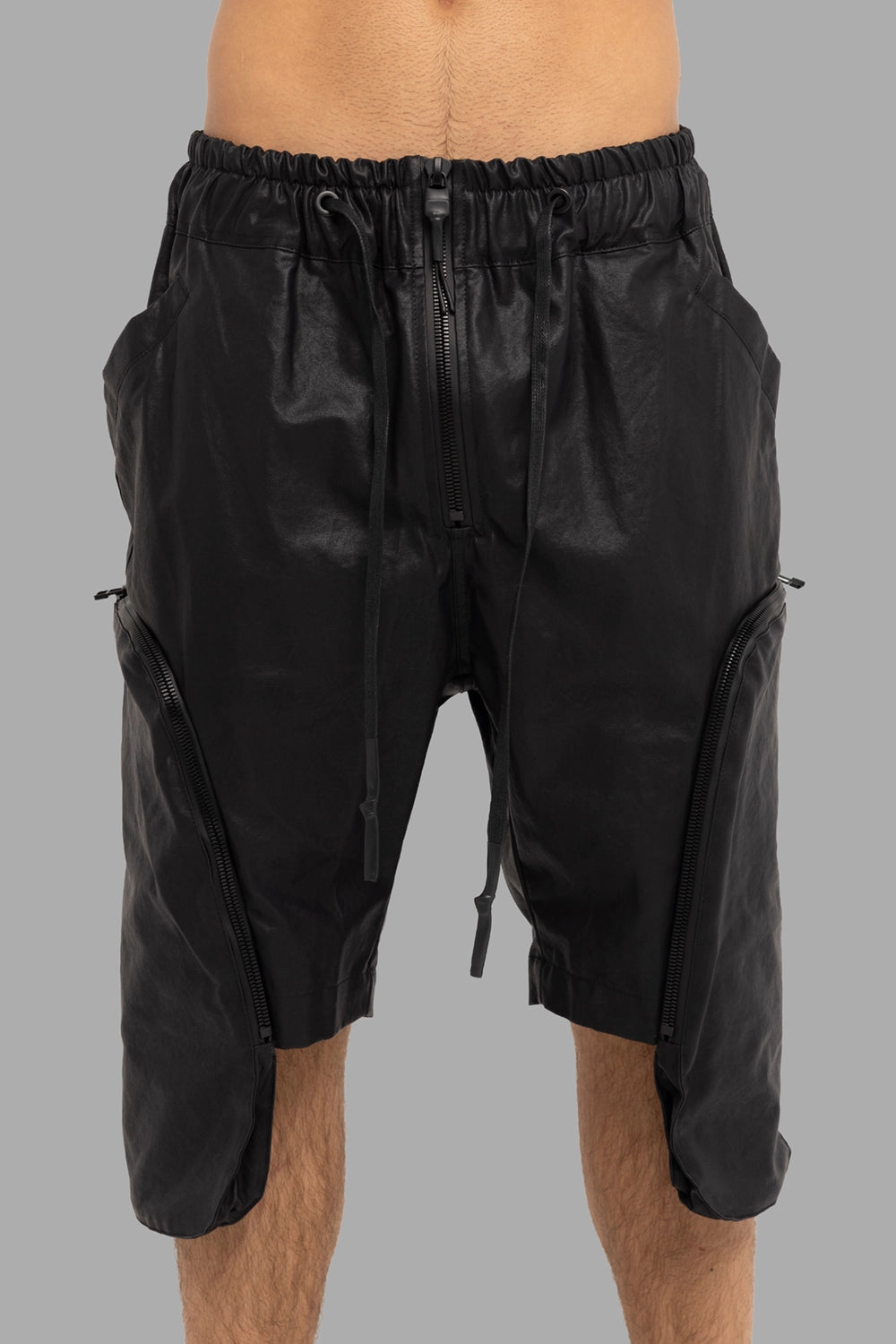 Justin Gall men’s cargo shorts in black, front view, central zip and 3D side zip pockets