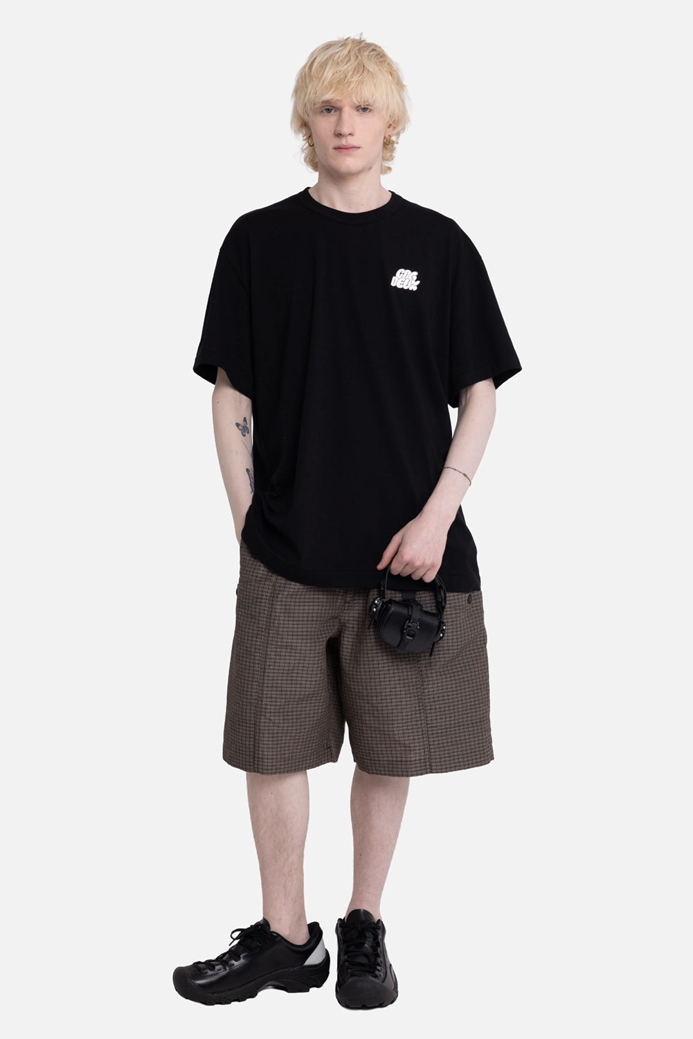 Comme des Garçons Homme men's cargo shorts in brown check, on-model full length, wide knee fit
