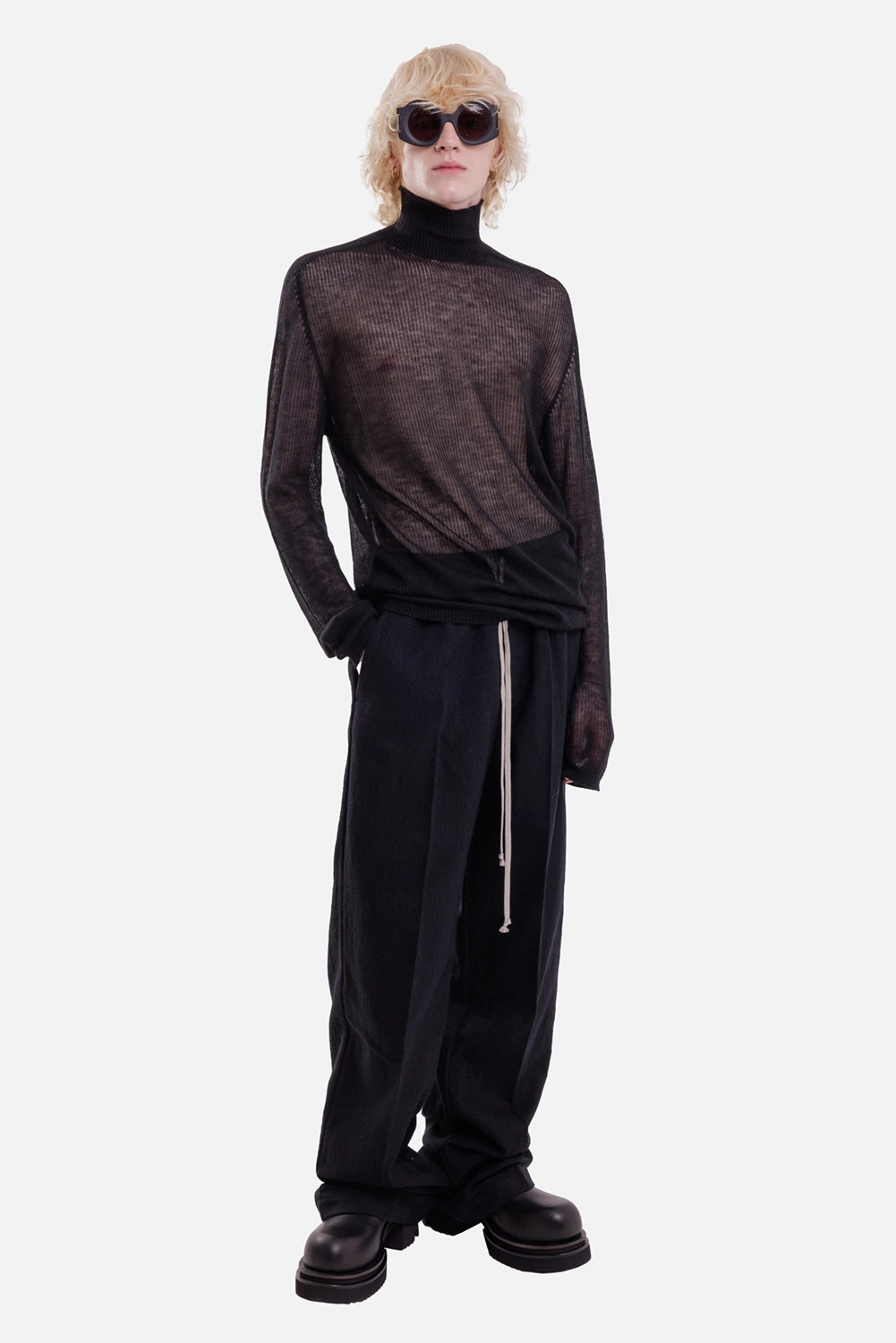 Rick Owens men's cashmere turtleneck in black, full-length view with semi-sheer ribbing and a loose longline fit