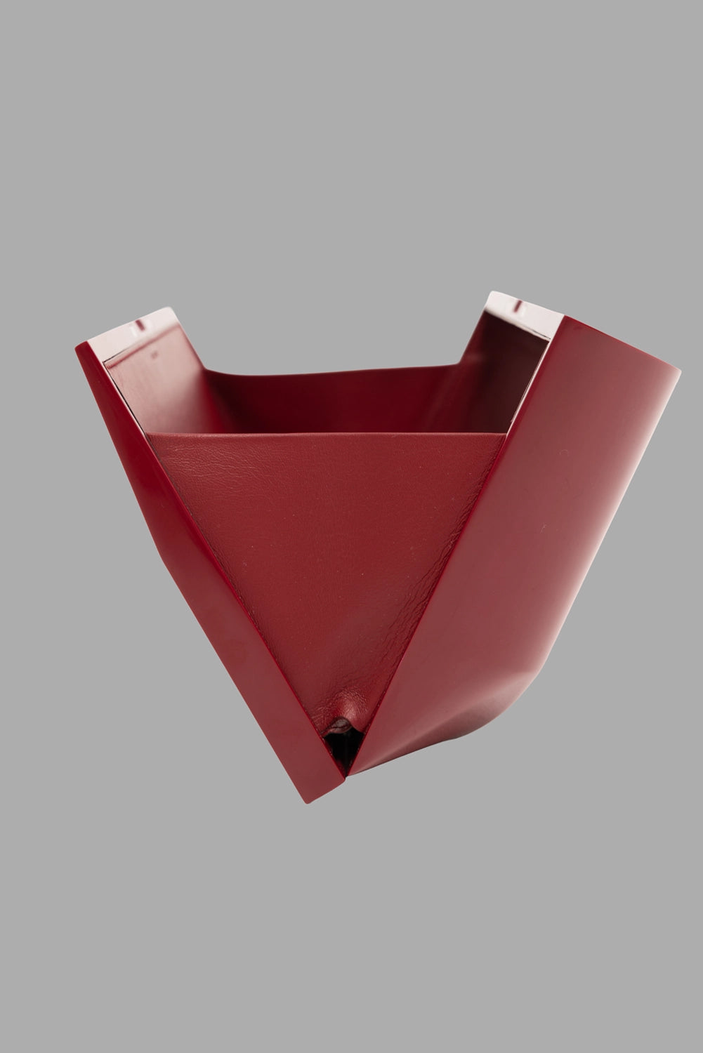 Rick Owens unisex large prong clutch in carnelian red, dynamic fold view, rigid sculptural shell