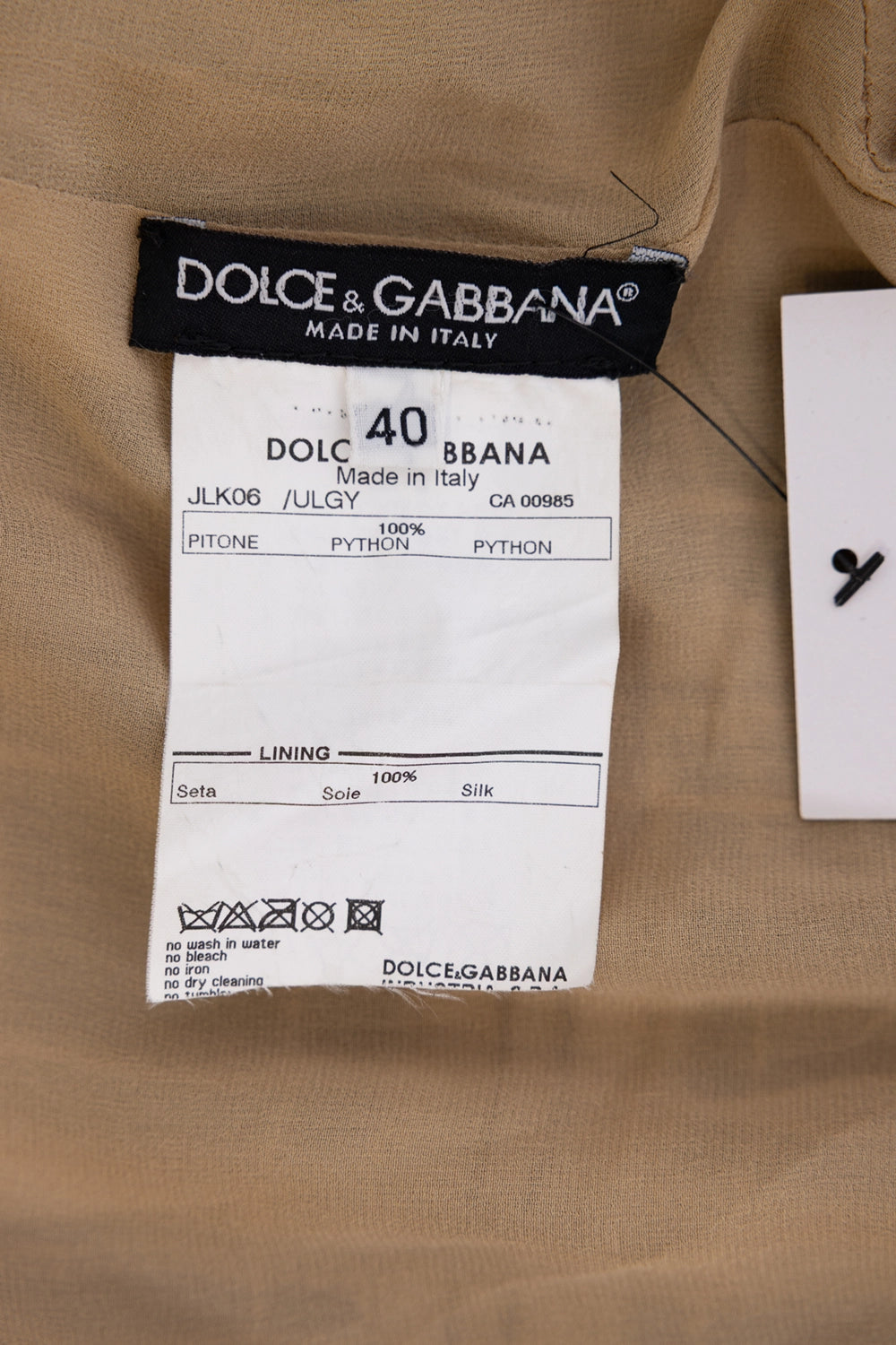 Pre-owned Dolce & Gabbana women’s coat in beige/multi, care label view, 100% python and 100% silk lining