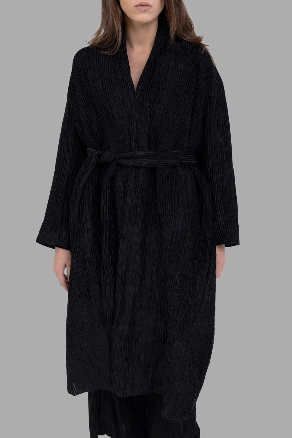 Masnada women coat in black, front view, wrap front with waist tie and vertical pleats