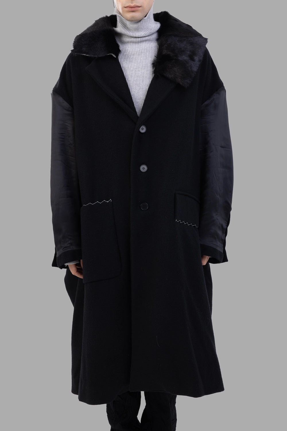 Giovanni Cavagna coat in black, front view, patch pockets and button closure