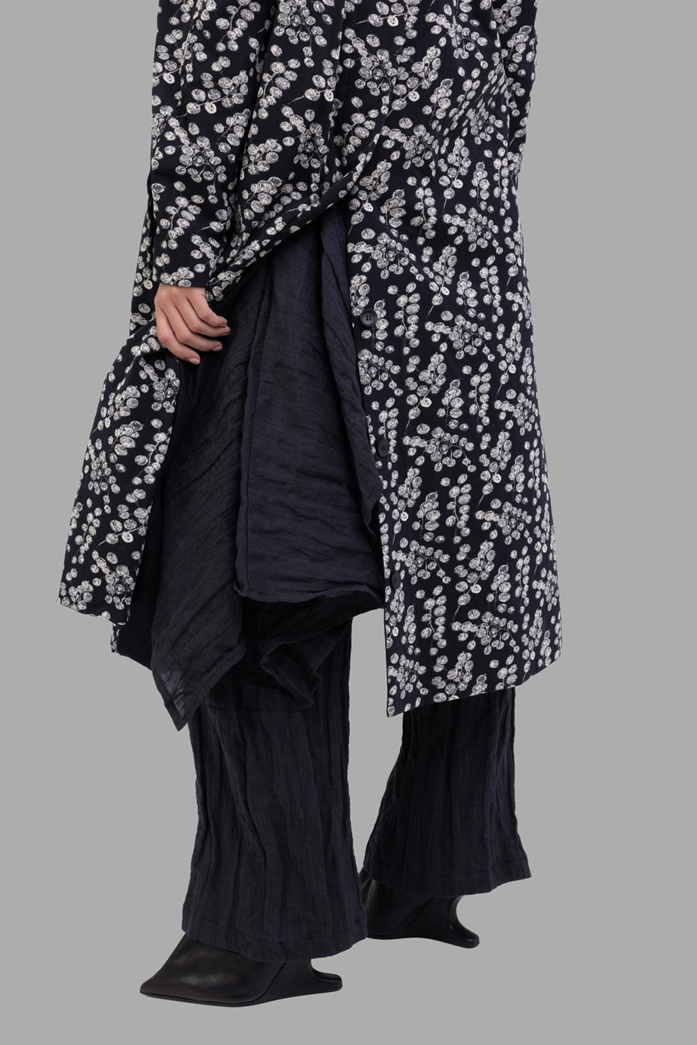 Marc Point women's printed coat in black, inner-panel detail, draped layer revealed at side opening