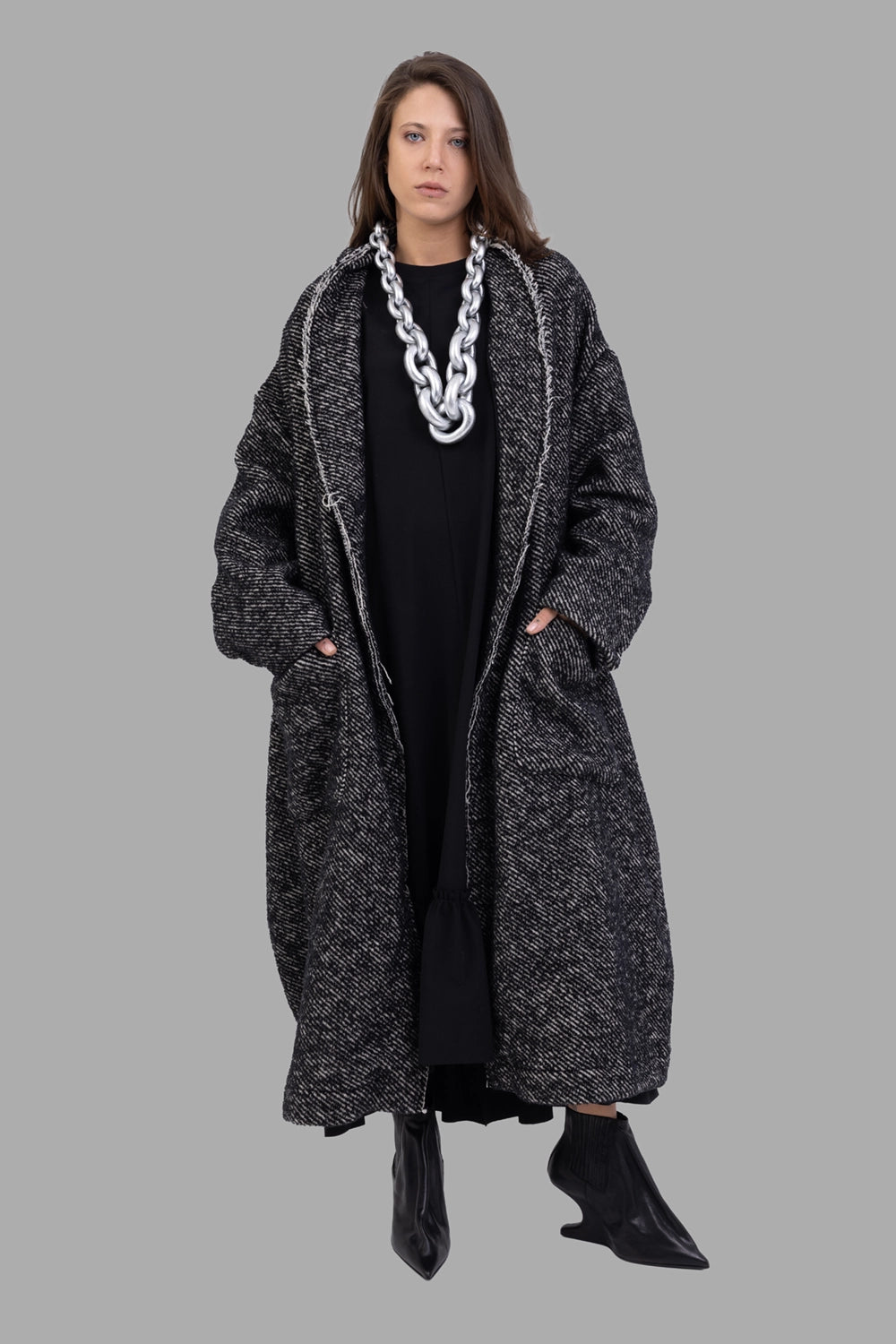 Giovanni Cavagna women cocoon coat in black, on-model full length, oversized shawl collar and voluminous silhouette.