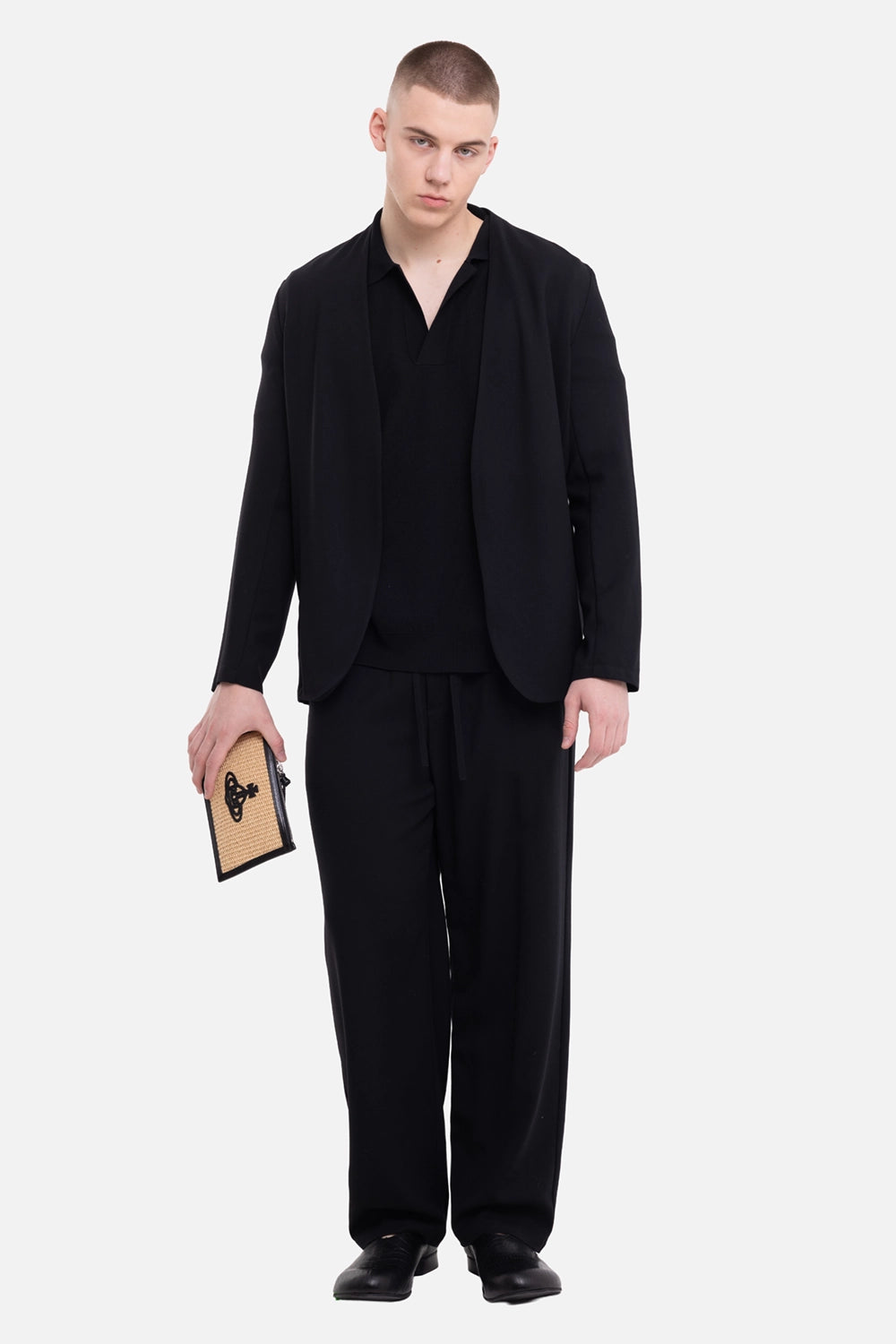 Attachment men's black collarless jacket, on-model full-length view, fluid drape and minimal silhouette